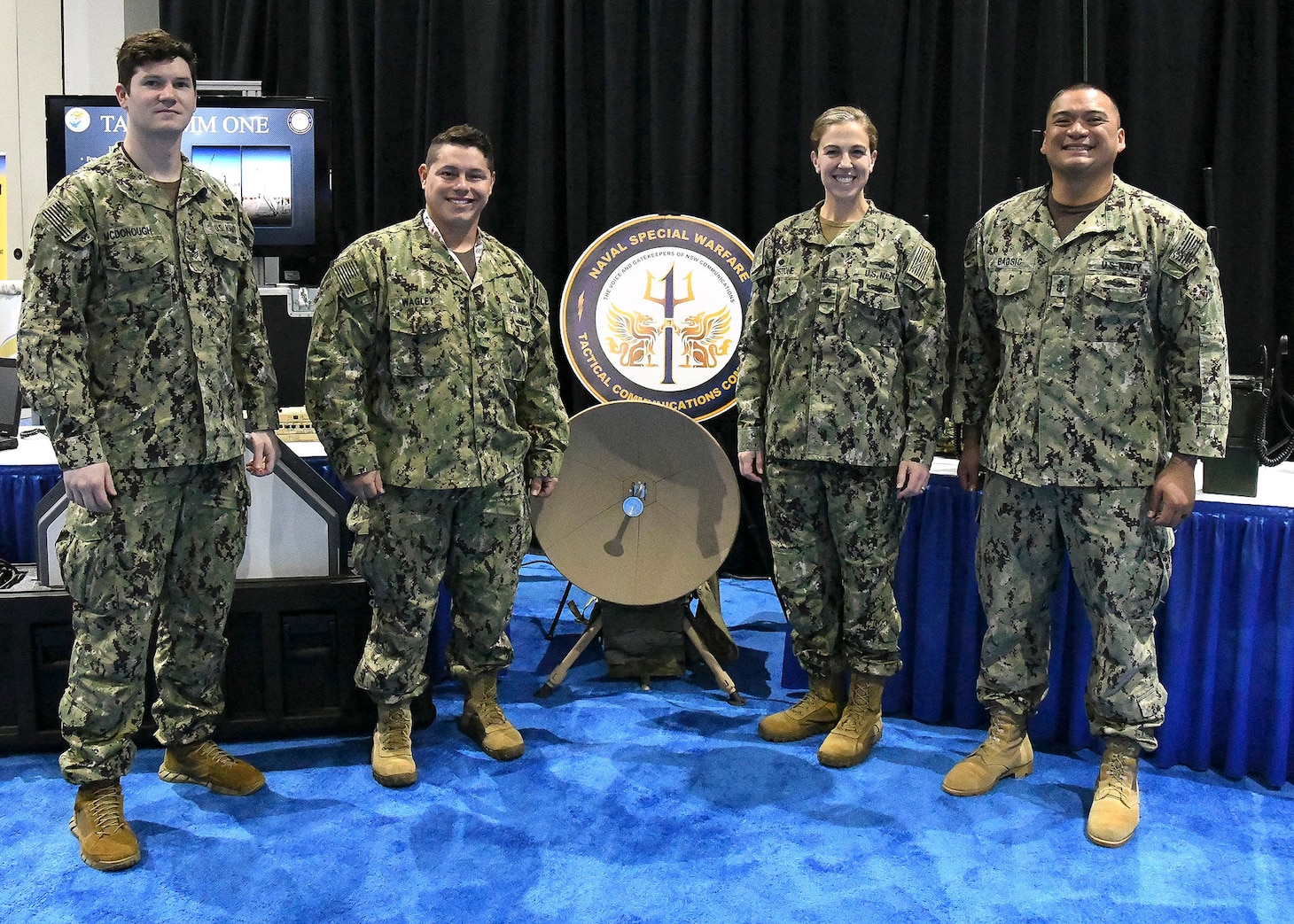 Cmdr. Blythe Blakistone, second from the right, commanding officer of Naval Special Warfare Tactical Communications Command (TCC) 1, and Sailors assigned to TCC-1 pose for a group photo at the Armed Forces Communications and Electronics Association-U.S. Naval Institute (AFCEA/USNI) West Convention.