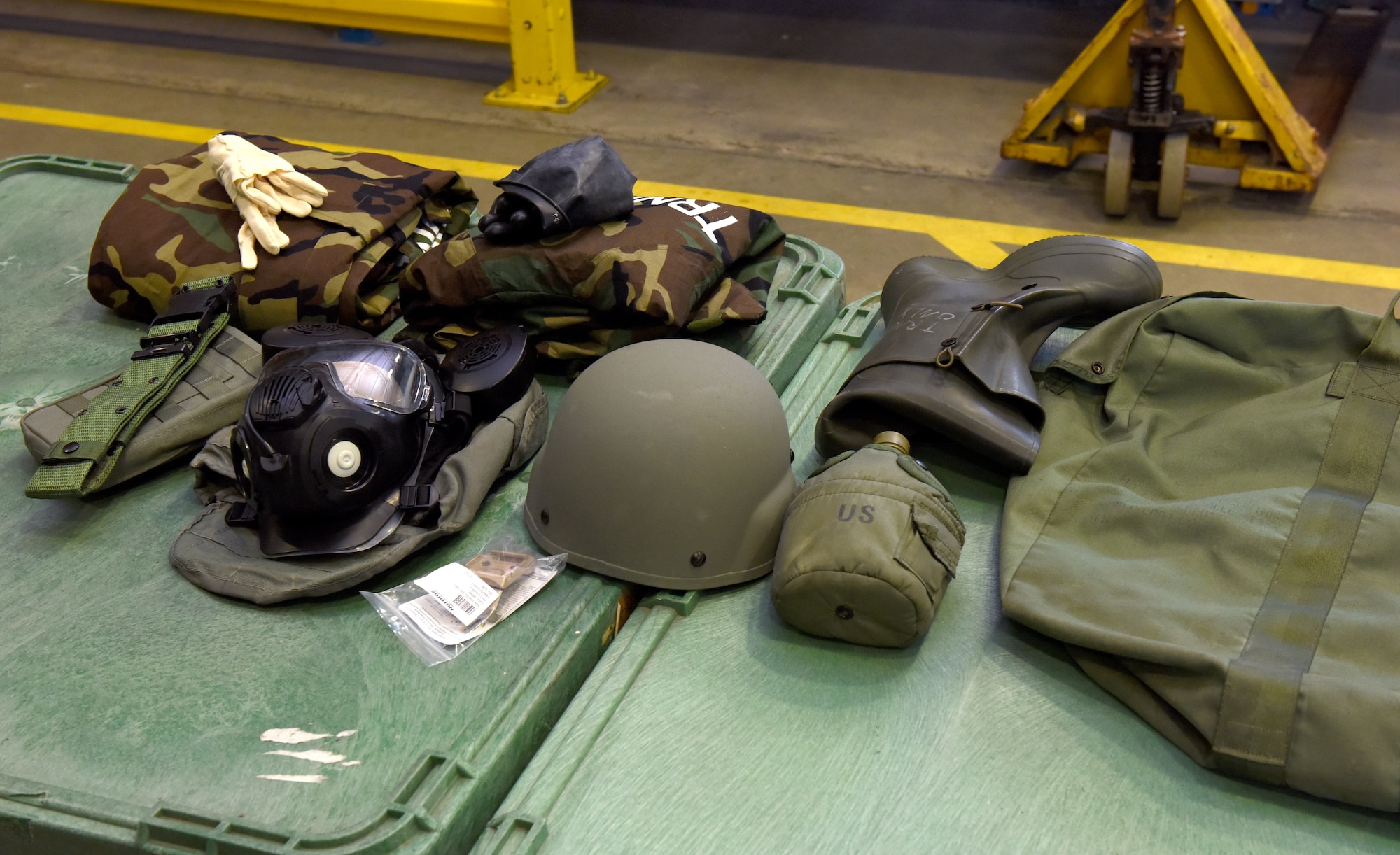 Items from a training “Class C” chemical bag are displayed in the 100th Logistics Readiness Squadron Individual Protective Equipment shop at Royal Air Force Mildenhall, England, March 15, 2022. Airmen in the IPE shop issue gas masks every Tuesday to base newcomers and are responsible for issuing and receiving all training and real-world chemical gear issued to military members. (U.S. Air Force photo by Karen Abeyasekere)
