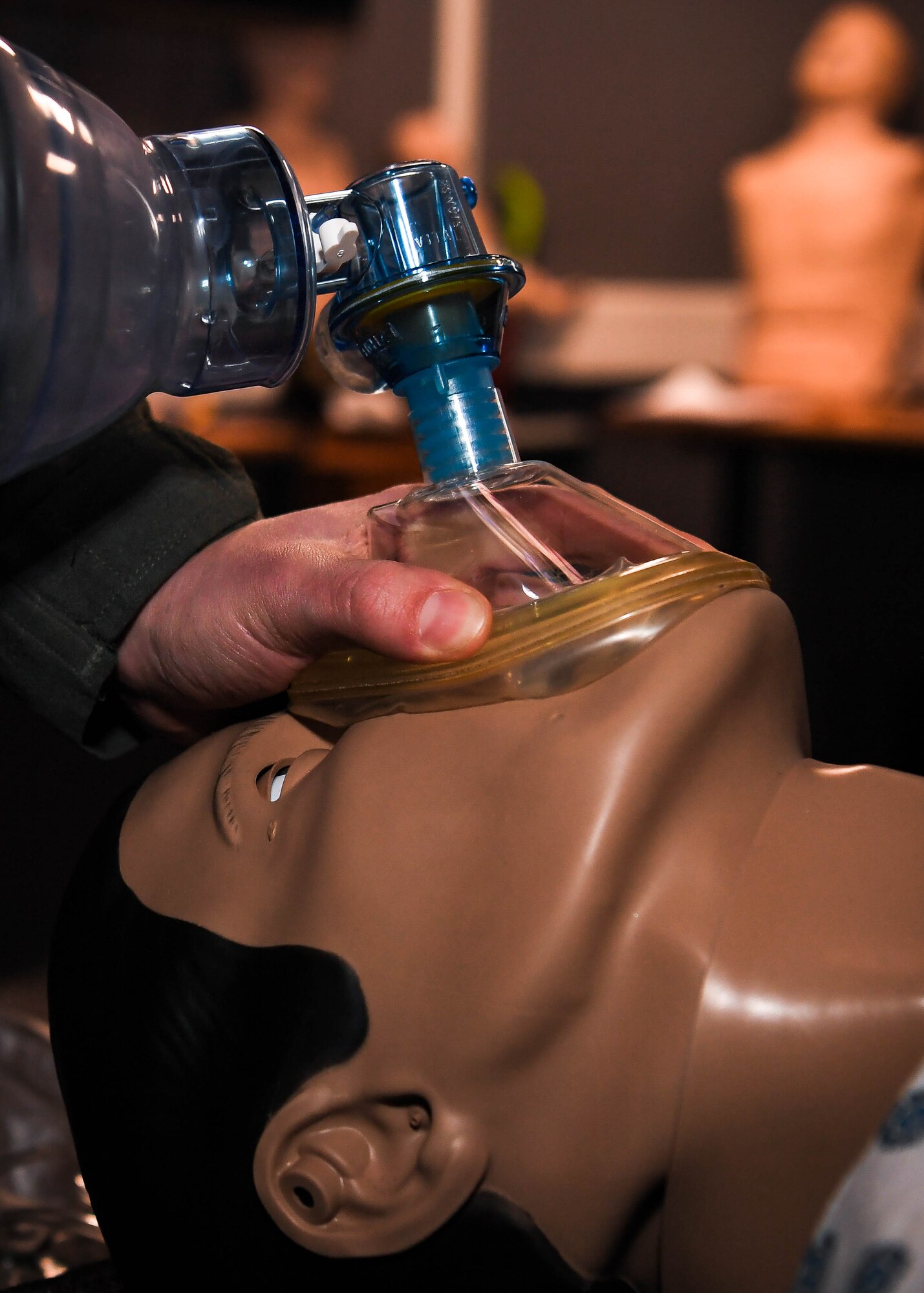 U.S. Air Force Capt. Adam Olligschlager, 86th Airlift Wing plans and programming action officer, practices bag-valve mask ventilation skills on a SimMan 3G at Ramstein Air Base, Germany, March 14, 2022. The 86th Aeromedical Evacuation Squadron uses the SimMan 3G for training purposes because it allows Airmen to perform compressions and it can simulate heartbeats and respirations. When Olligschlager isn’t working as an action officer, he assumes regular duties as a flight nurse evaluator at the 86th Aeromedical Evacuation Squadron. (U.S. Air Force photo by Airman 1st Class Jared Lovett)