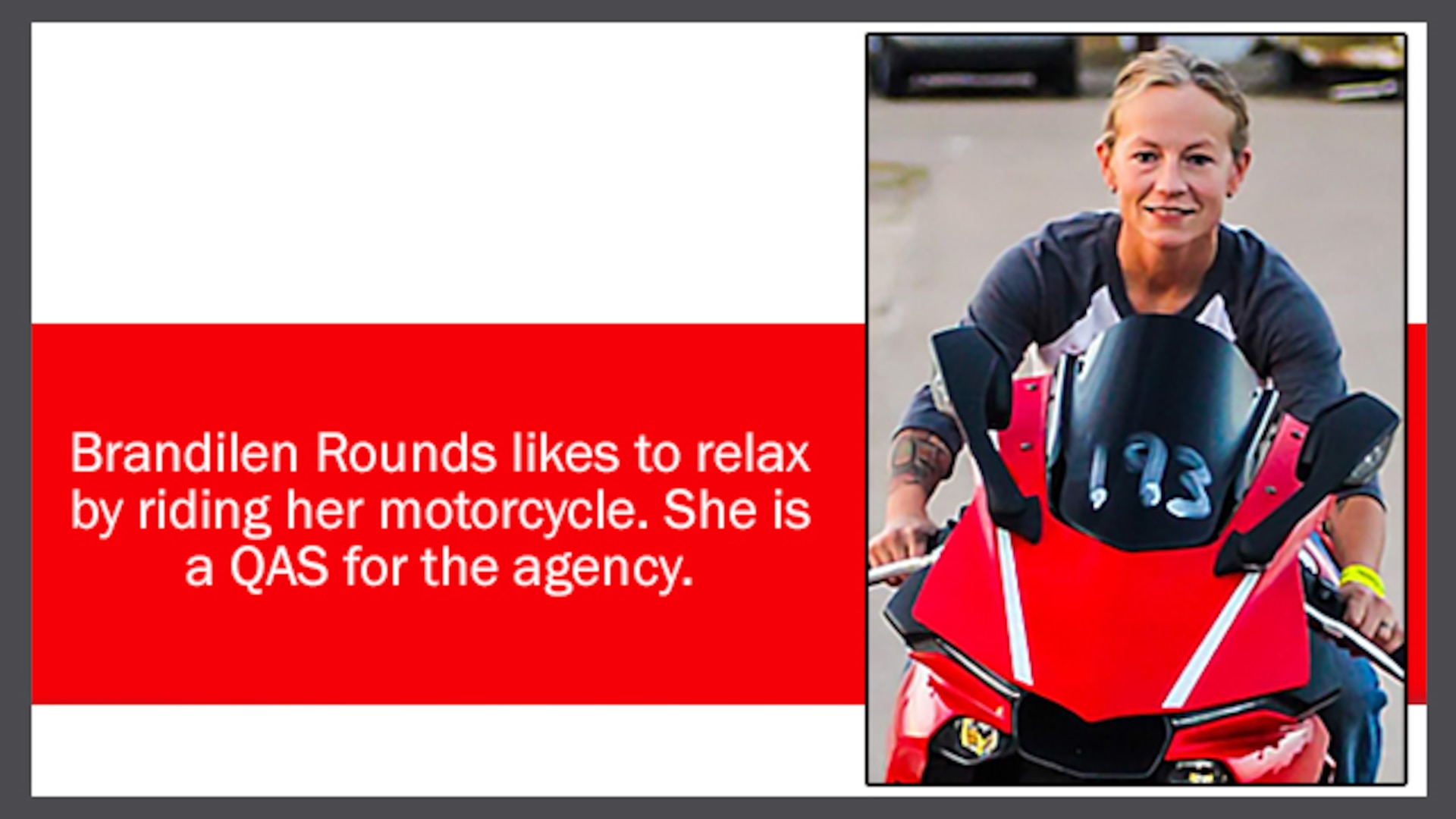Smiling woman riding a red motorcycle