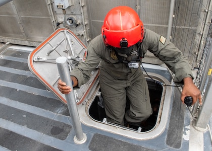 BM2 Michael Tige goes below deck of the Landing Craft Air Cushion.