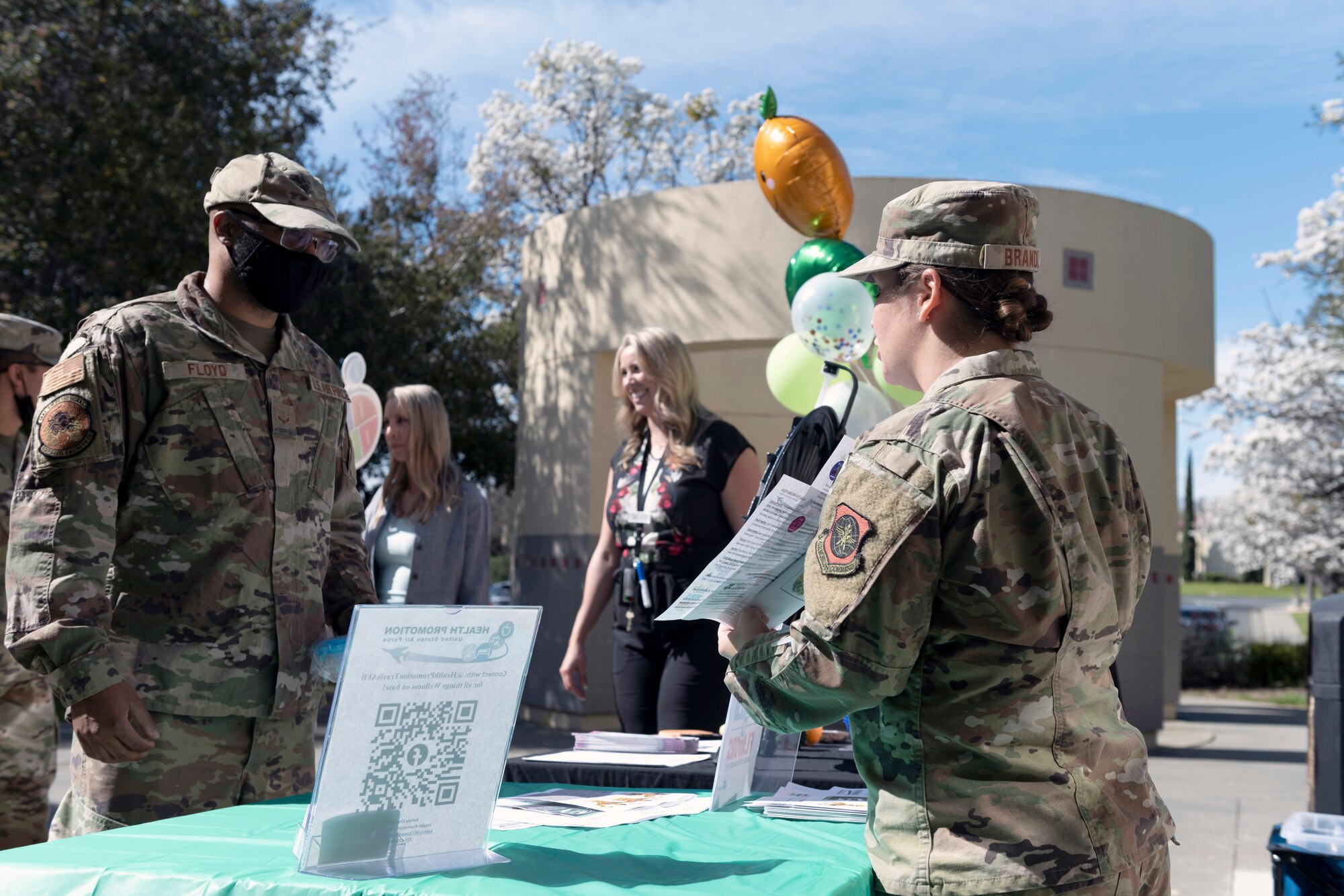 U.S. Air Force 1st Lt. Lauren Brandl, right, 60th Medical Group Outpatient Nutrition Clinic chief, briefs Airmen on the importance of healthy eating habits at Travis Air Force Base, California, March 1, 2022. To push this years’ theme ‘Celebrating a World of Flavors,’ the 60th Medical Group Nutritional Medicine outpatient nutrition clinic and Health Promotion Services have partnered together for multiple events across the base, highlighting March as National Nutrition Month. (U.S. Air Force photo by Senior Airman Jonathon Carnell)