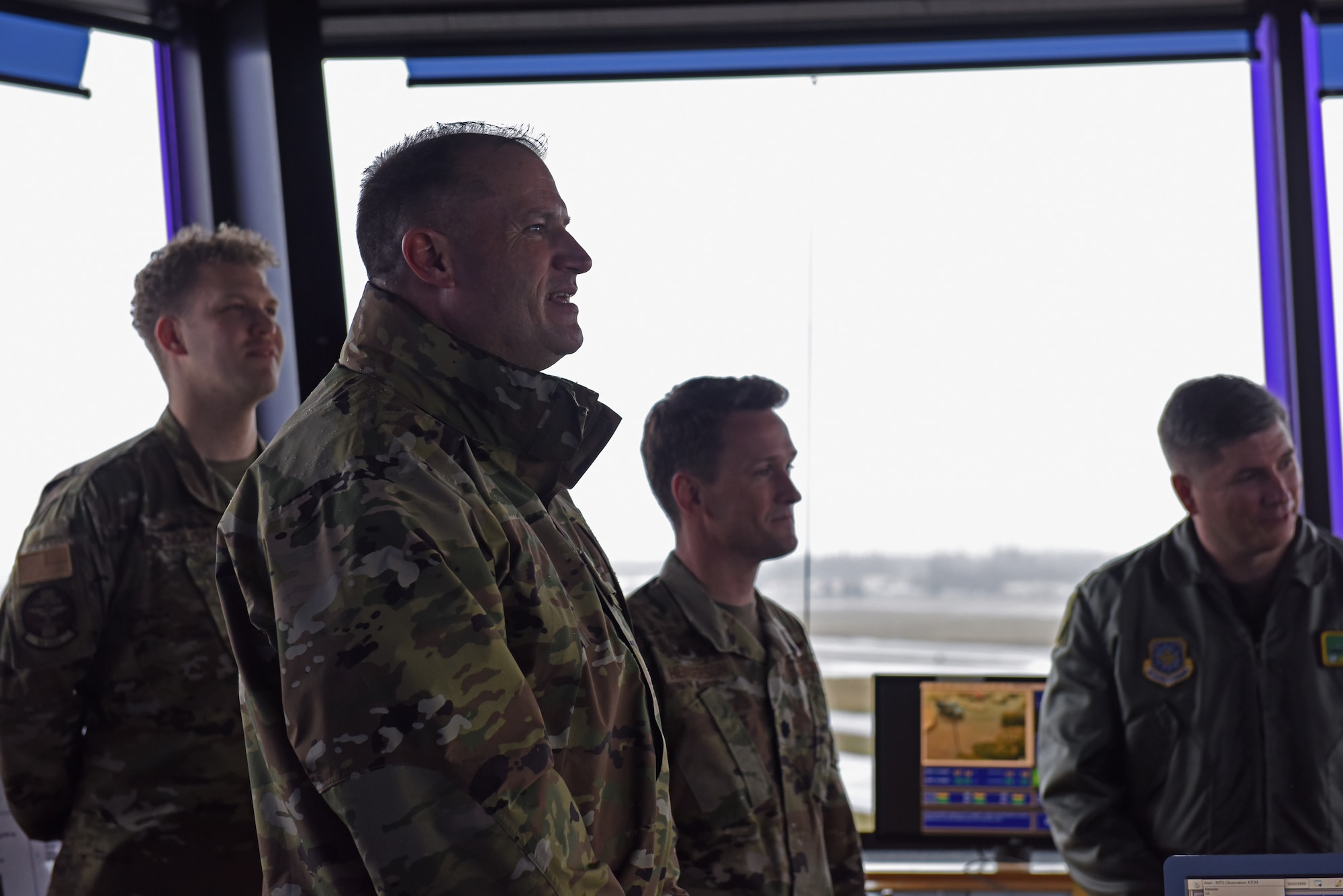 (Center) U.S. Air Force Maj. Gen. Thad Bibb, 18th Air Force commander, engages with 62nd Airlift Wing air traffic controllers, during his visit at Joint Base Lewis-McChord, Washington, March 14, 2022. Bibb and U.S. Air Force Chief Master Sgt. Chad Bickley, 18th AF command chief, spent two days visiting 62nd AW units and recognized several of the wing’s outstanding performers during their time. (U.S. Air Force photo/Senior Airman Zoe Thacker)