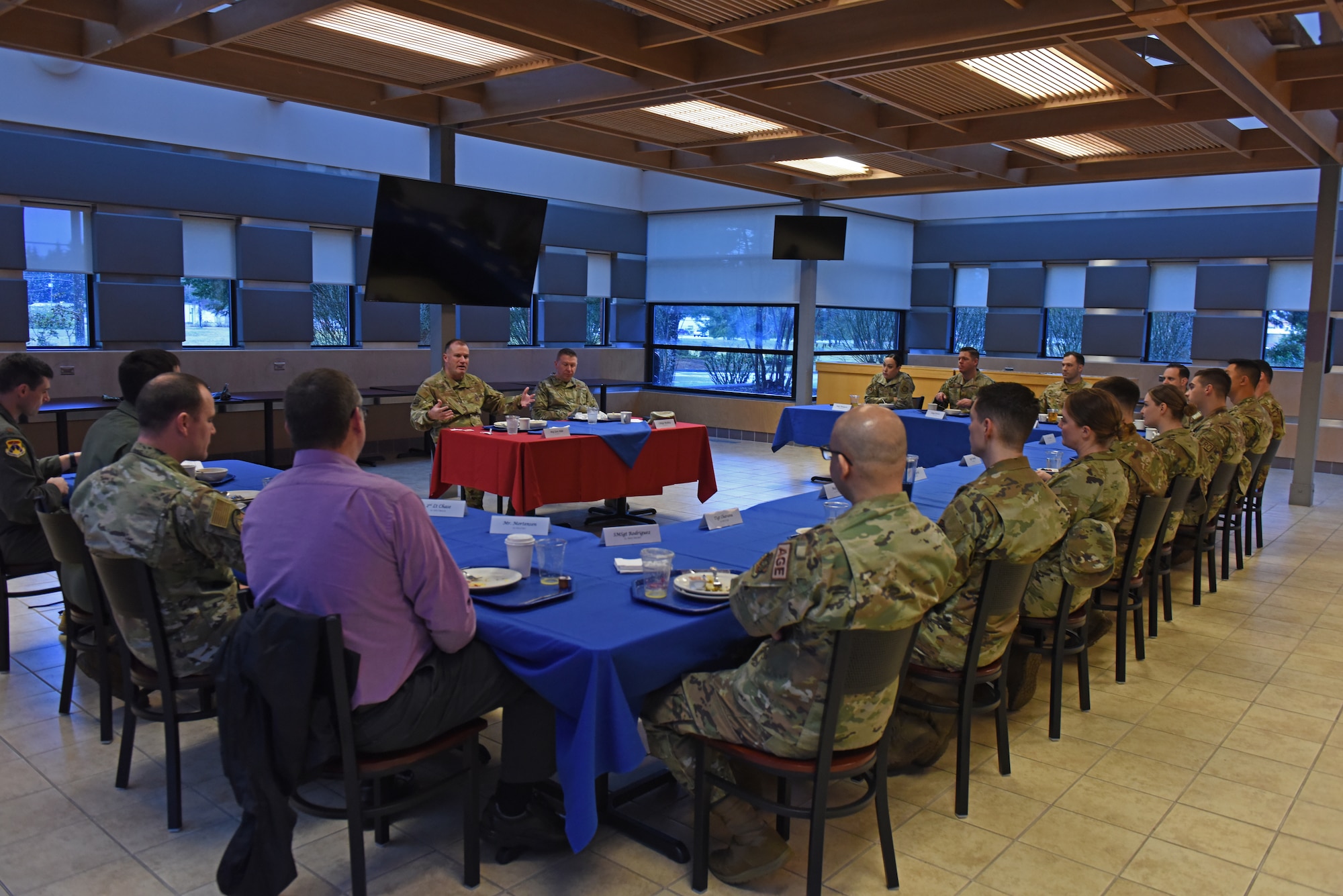 U.S. Air Force Maj. Gen. Thad Bibb, 18th Air Force commander, and U.S. Air Force Chief Master Sgt. Chad Bickley, 18th AF command chief, engage with Team McChord Airmen during a breakfast engagement at Joint Base Lewis-McChord, Washington, March, 15, 2022. The Airmen received the opportunity to be mentored by 18th AF leadership and to ask any questions they had. (U.S. Air Force photo/Senior Airman Zoe Thacker)