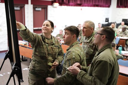 Command Sgt. Maj. Curtis Patrouille, the Wisconsin Army National Guard’s senior enlisted leader, engages with noncommissioned officers taking part in the first Squad Leader Training event at Volk Field, Wisconsin, March 13, 2022.