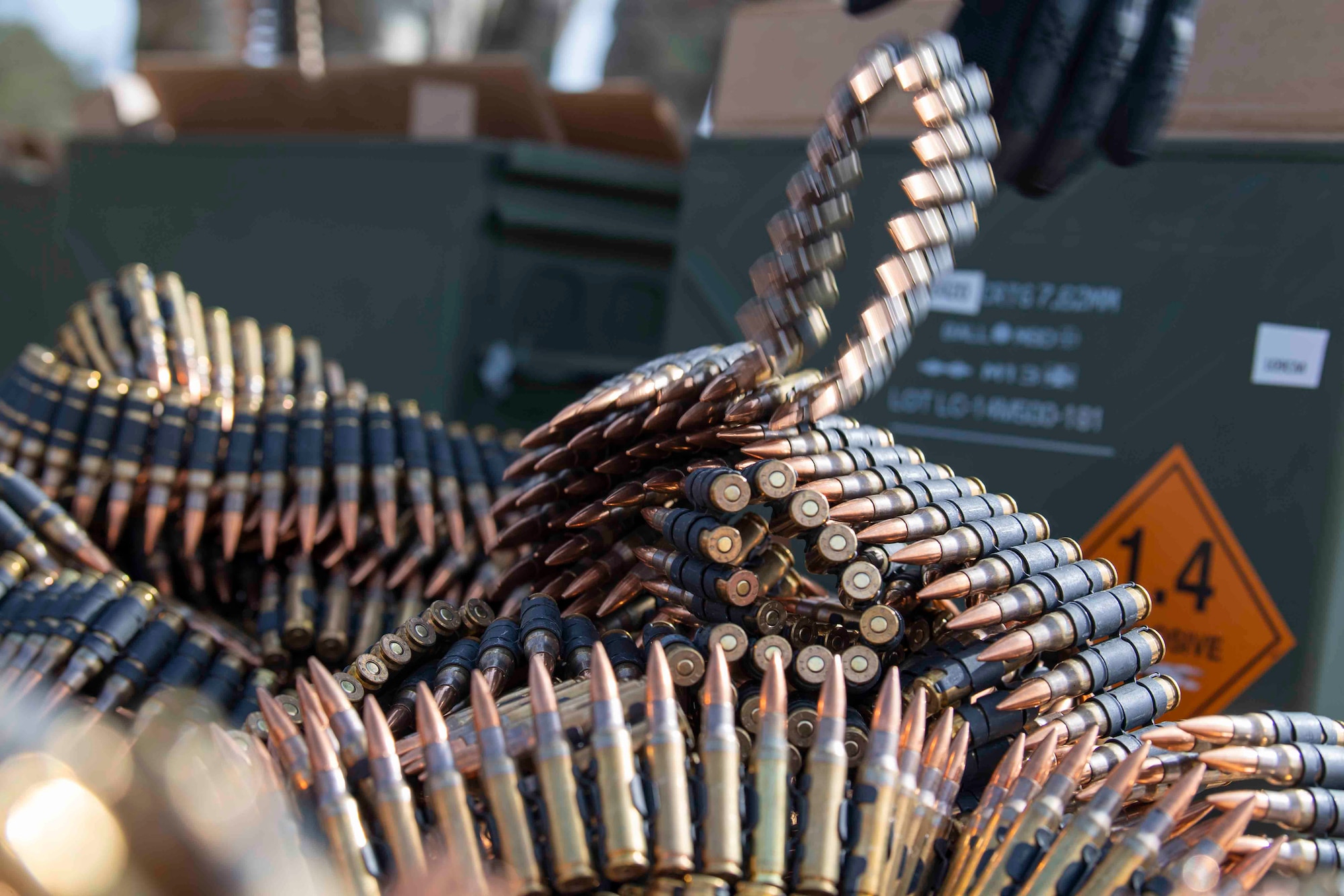 A pile of ammunition for the M240 light machine gun unravels on the ground during weapons training at Combined Arms Training Center Camp Fuji, Japan, March 10, 2022.