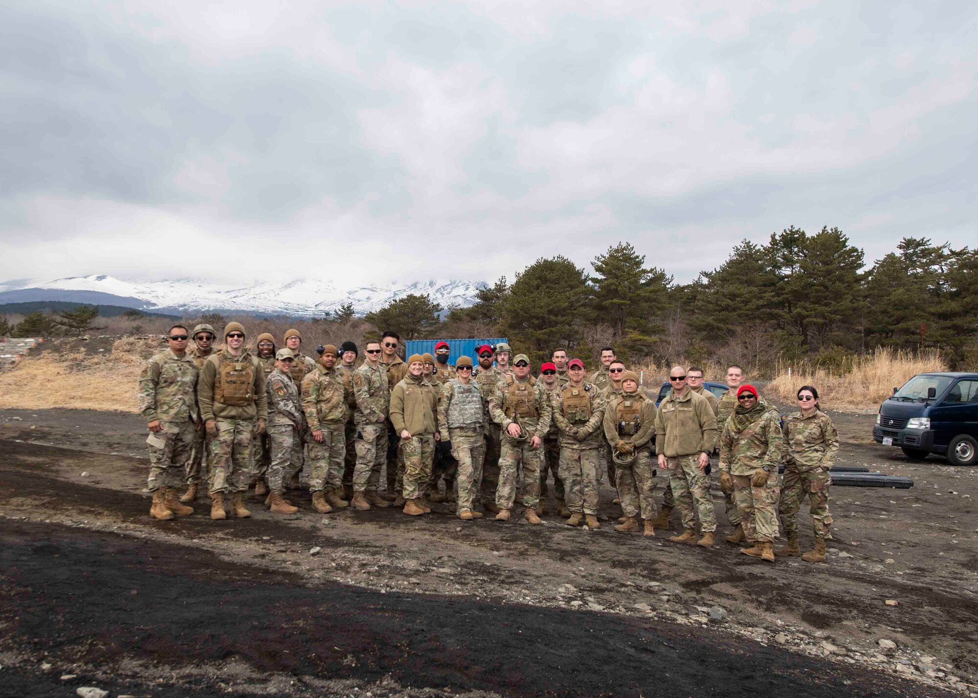 Defenders with the 374th Security Forces Squadron and Yokota leadership pose for a photo after an M240 and M249 machine guns qualification at Combined Arms Training Center Camp Fuji, Japan, March 10, 2022.
