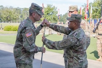 Command Sgt. Maj. Walter Tagalicud (right), outgoing 3rd Infantry Division command sergeant major, presents a saber to Maj. Gen. Leopoldo Quintas, the 3rd ID commander, at a relinquishment of responsibility ceremony at Fort Stewart, Ga. on May 19, 2017.