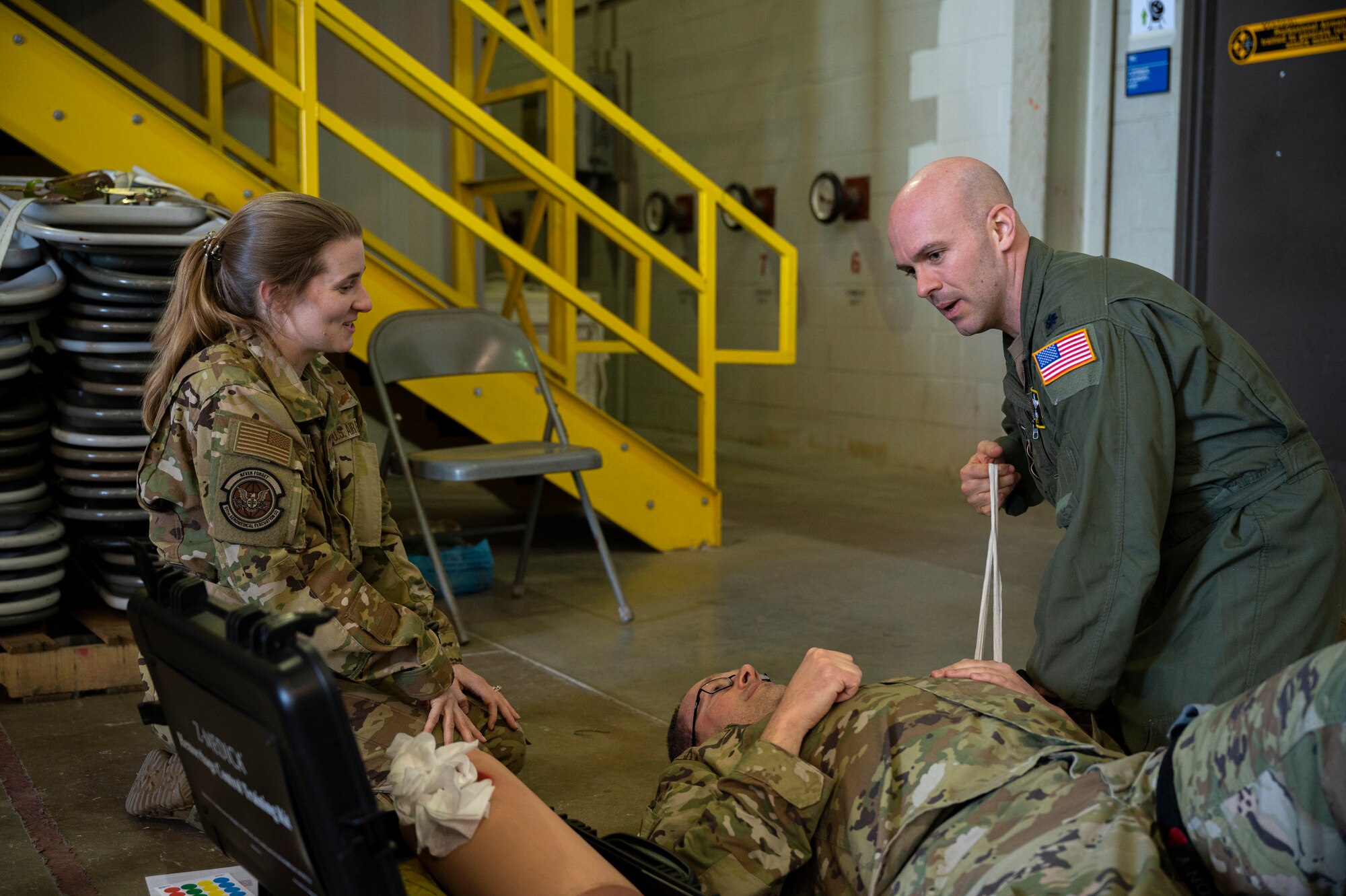 Airmen performing life-saving techniques