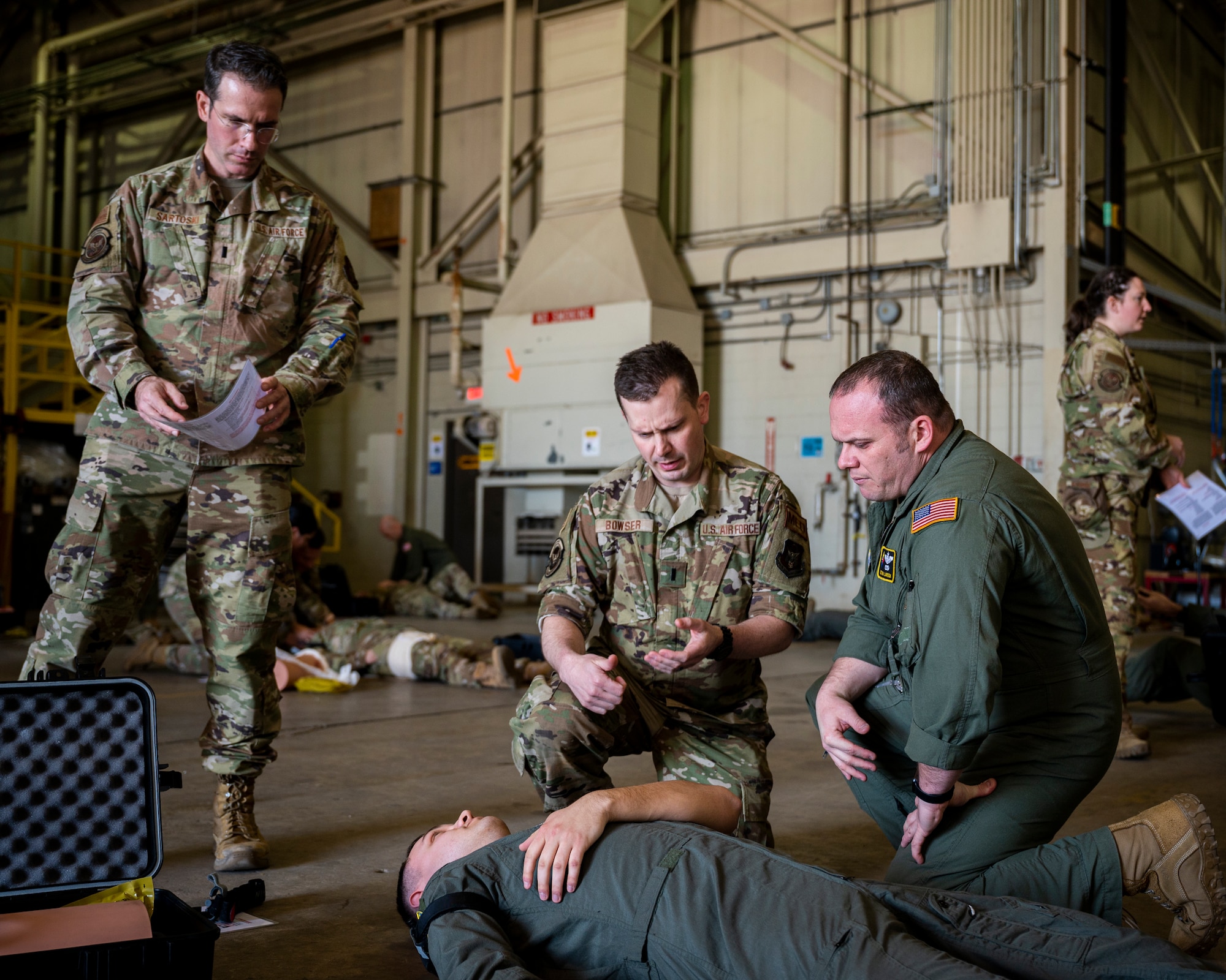 Airmen performing life-saving techniques