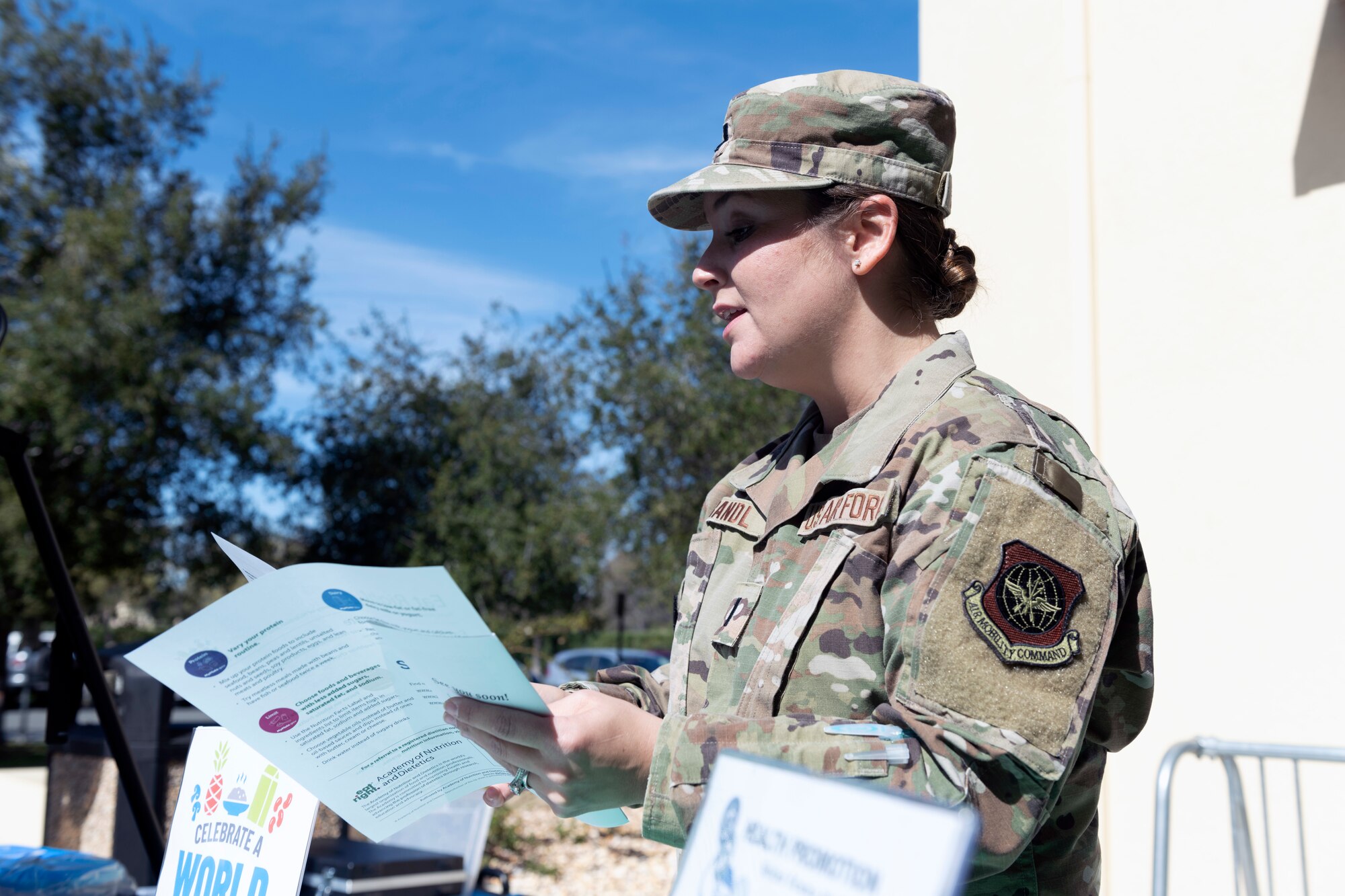 U.S. Air Force 1st Lt. Lauren Brandl, right, 60th Medical Group Outpatient Nutrition Clinic chief, briefs Airmen on the importance of healthy eating habits at Travis Air Force Base, California, March 1, 2022. To push this years’ theme ‘Celebrating a World of Flavors,’ the 60th Medical Group Nutritional Medicine outpatient nutrition clinic and Health Promotion Services have partnered together for multiple events across the base, highlighting March as National Nutrition Month. (U.S. Air Force photo by Senior Airman Jonathon Carnell)