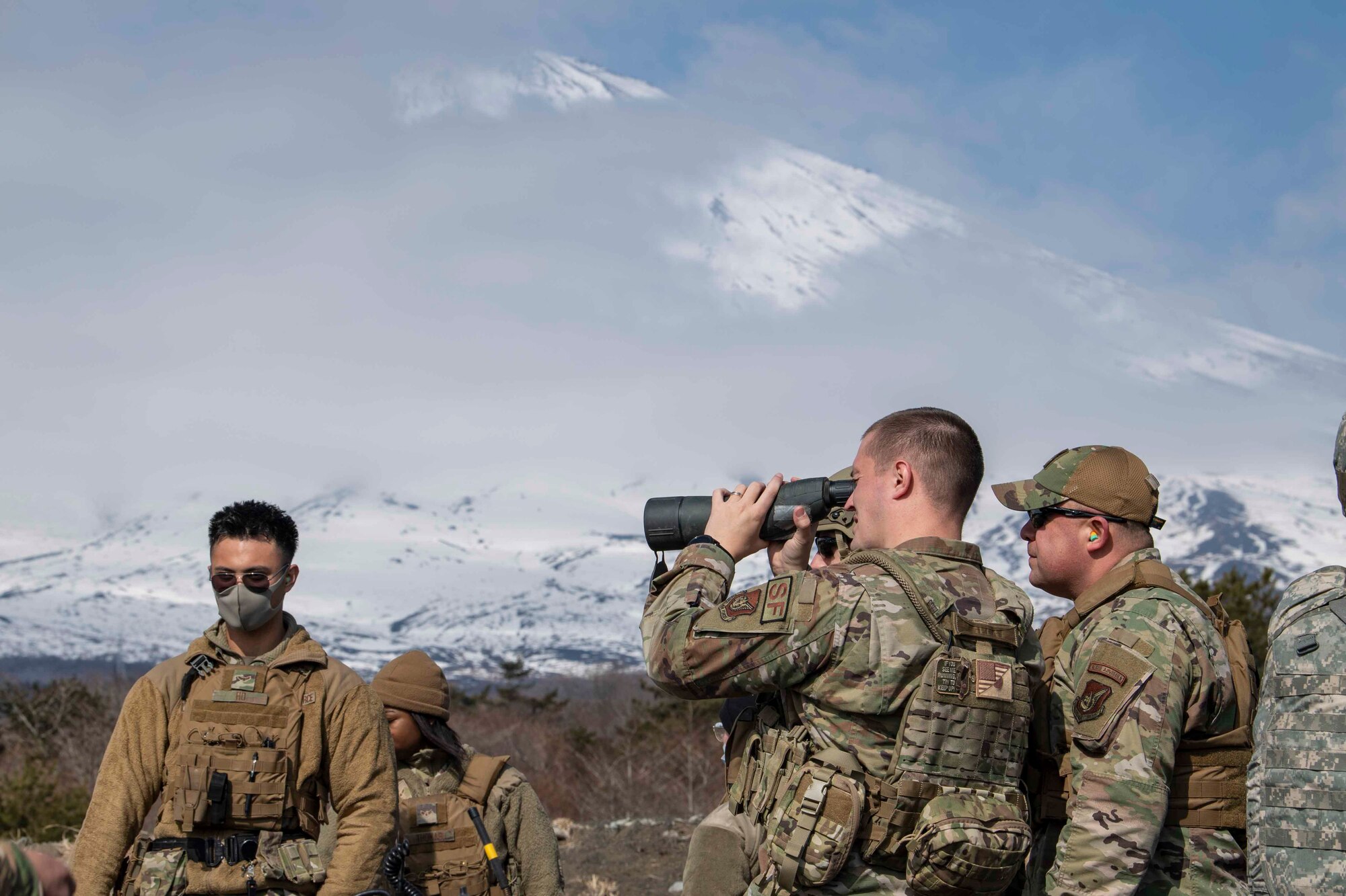 Capt. James Hughes, 374th Security Forces Squadron director of operations, and Col. Patrick Launey, 374th Mission Support Group commander, check targets prior to an M240 and M249 machine guns qualification at Combined Arms Training Center Camp Fuji, Japan, March 10, 2022.