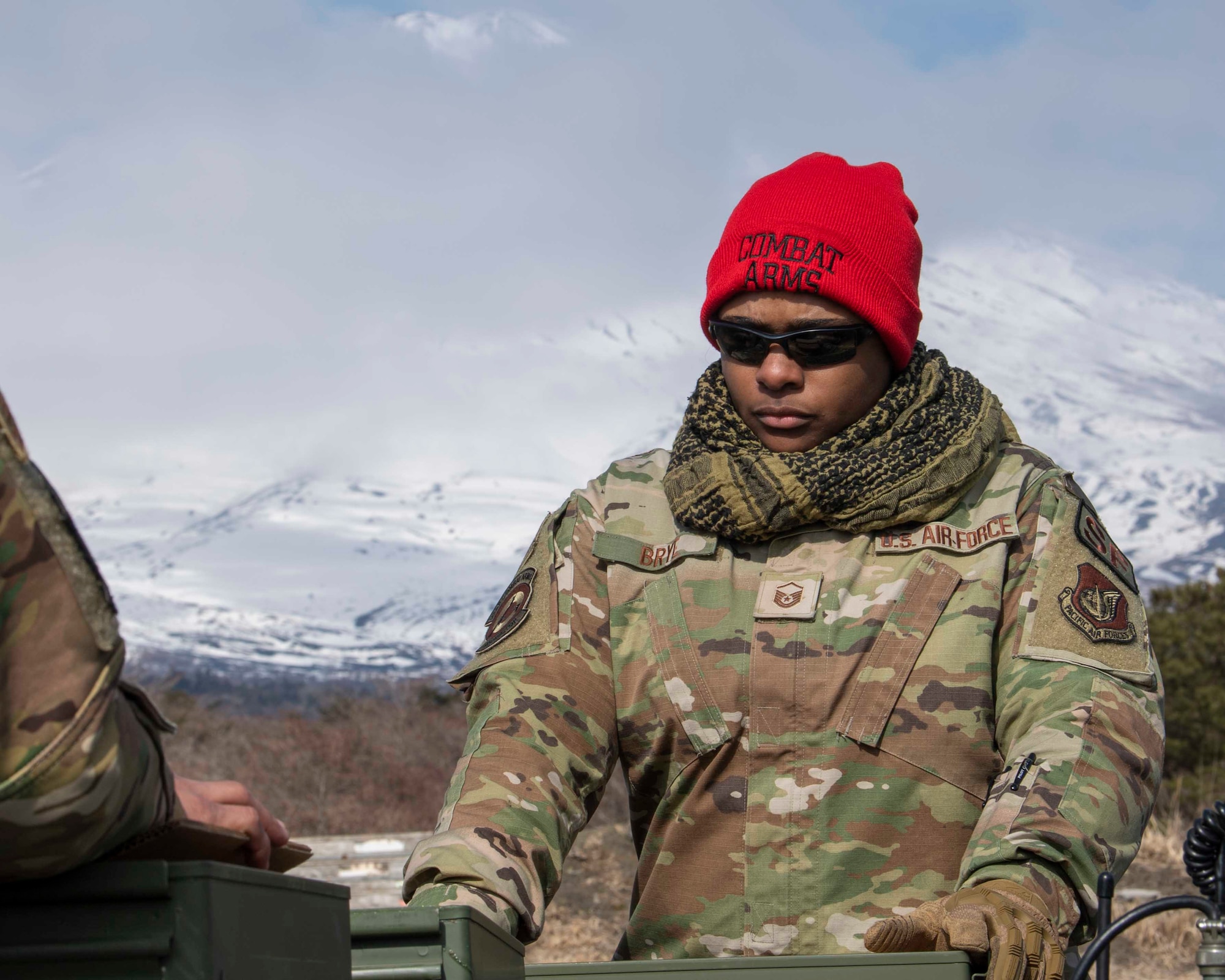 Master Sgt. Alexandria Brye, 374th Security Forces Squadron combat arms training and maintenance non-commissioned officer in charge, inspects ammo prior to an M240 and M249 machine guns qualification at Combined Arms Training Center Camp Fuji, Japan, March 10, 2022.