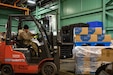 U.S. Army Staff Sgt. Jessica Perez, a motor transport operator assigned to the 1048th Medium Transportation Company, 143rd Combat Sustainment Support Battalion, Connecticut Army National Guard, operates a forklift to move COVID-19 relief supplies at the State Commodity Warehouse, New Britain, Connecticut, March 8, 2022.