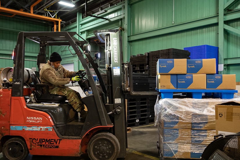 U.S. Army Staff Sgt. Jessica Perez, a motor transport operator assigned to the 1048th Medium Transportation Company, 143rd Combat Sustainment Support Battalion, Connecticut Army National Guard, operates a forklift to move COVID-19 relief supplies at the State Commodity Warehouse, New Britain, Connecticut, March 8, 2022.