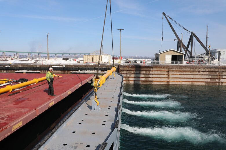 The U.S. Army Corps of Engineers, Detroit District, Soo Area Office will open the Poe Lock, 12:01 a.m., March 25, marking the 2022 Great Lakes shipping season start. Jim Young waits for the water in the Poe Lock to reach the Lake Superior level before removing the next stop log.