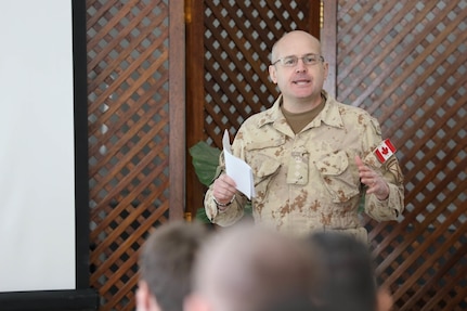 Canadian Col. Ryan Jurkowski, director of strategic communications, Combined Joint Task Force – Operations Inherent Resolve (CJTF – OIR), conducts a brief on competition in the information environment during the defense attaché forum in Baghdad, Iraq, March 17, 2022. The defense attaché forum serves as an opportunity to build-relationships among Global Coalition members, and as a gateway to discuss topics pertaining to the enduring defeat of Da’esh including CJTF – OIR’s progress and areas of needed improvement. (U.S. Army photo by Staff Sgt. Bree-Ann Ramos-Clifton)