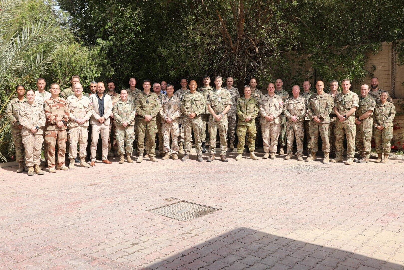 Defense attaches and global coalition members pose for a photograph during the defense attaché forum in Baghdad, Iraq, March 17, 2022. The defense attaché forum serves as an opportunity to build-relationships among Global Coalition members, and as a gateway to discuss topics pertaining to the enduring defeat of Da’esh including CJTF – OIR’s progress and areas of needed improvement. (U.S. Army photo by Staff Sgt. Bree-Ann Ramos-Clifton)
