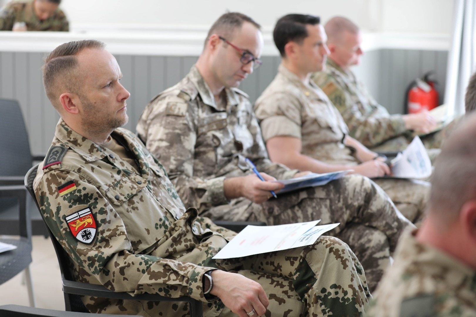 A German Coalition member listens intently during the defense attaché forum in Baghdad, Iraq, March 17, 2022. The defense attaché forum serves as an opportunity to build-relationships among Global Coalition members, and as a gateway to discuss topics pertaining to the enduring defeat of Da’esh including Combined Joint Task Force – Operation Inherent Resolve’s progress and areas of needed improvement. (U.S. Army photo by Staff Sgt. Bree-Ann Ramos-Clifton)