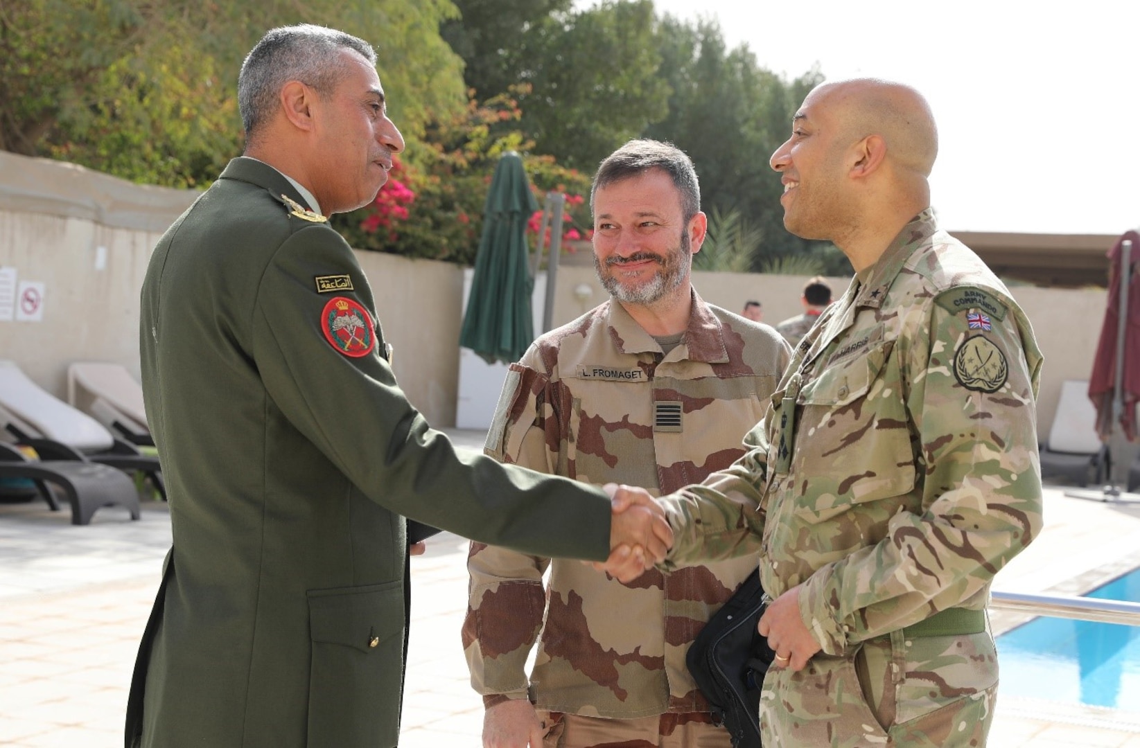 British Brig. Gen. Karl Harris, the deputy commanding general of Combined Joint Task Force – Operation Inherent Resolve (CJTF-OIR), and Jordan Brig. Gen. Raed Saud Alijbour, defense attaché, shake hands before the defense attaché forum begins in Baghdad, Iraq, March 17, 2022. The defense attaché forum serves as an opportunity to build-relationships among Global Coalition members, and as a gateway to discuss topics pertaining to the enduring defeat of Da’esh including Combined Joint Task Force – Operation Inherent Resolve’s progress and areas of needed improvement. (U.S. Army photo by Staff Sgt. Bree-Ann Ramos-Clifton)