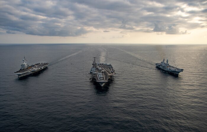 From left to right, the French aircraft carrier Charles de Gaulle (R 91), the Nimitz-class aircraft carrier USS Harry S. Truman (CVN 75) and the Italian aircraft carrier ITS Cavour (C 550) transit the Ionian Sea in formation, Mar. 17, 2022.