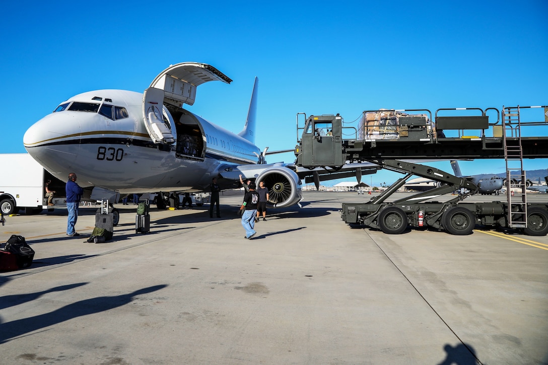 Personnel depart Joint Base Pearl Harbor-Hickam to assist in the COVID-19 pandemic.