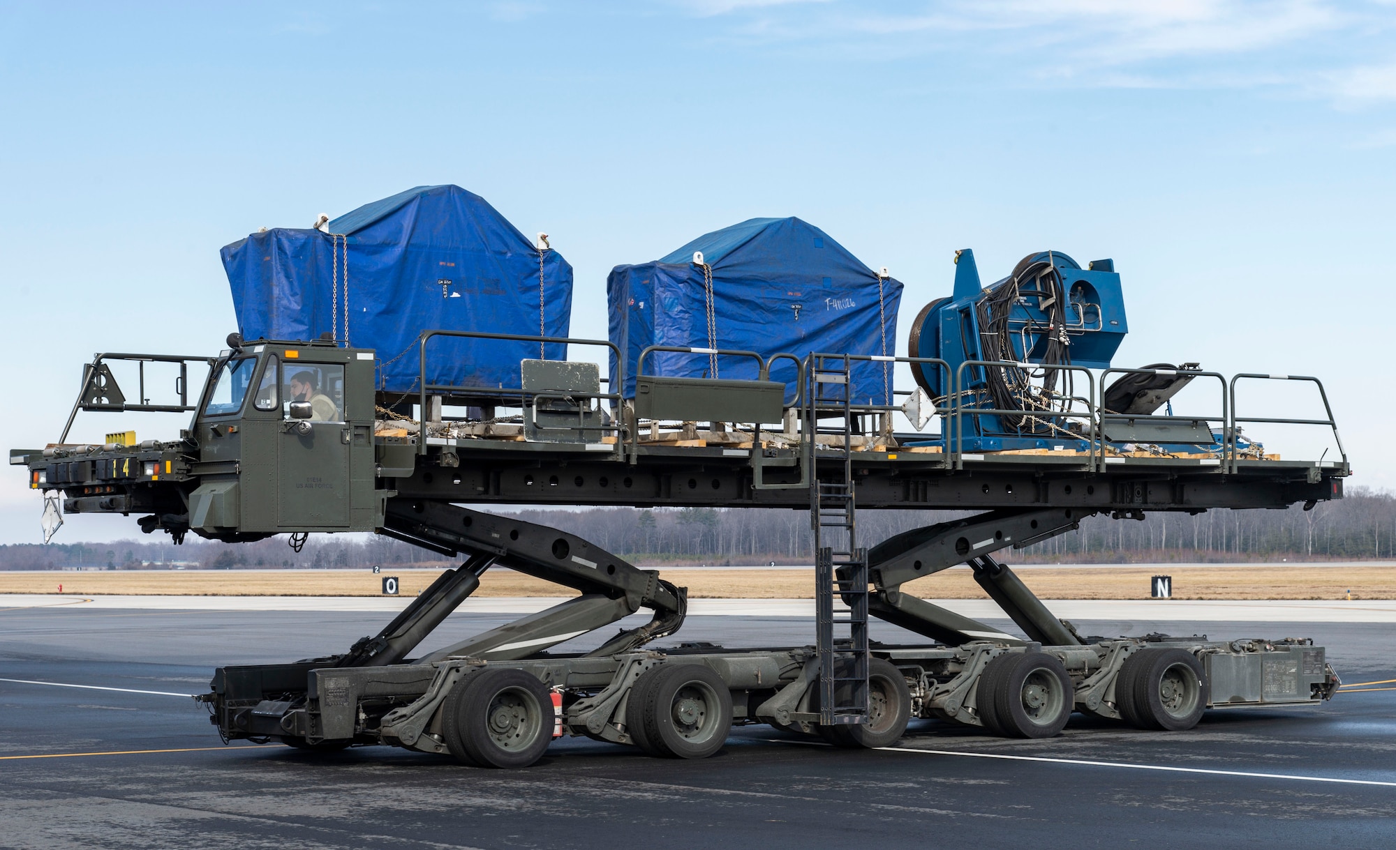 Staff Sgt. Brett Dehner, 436th Aerial Port Squadron ramp services supervisor, positions a cargo loader at the rear of a C-5M Super Galaxy at Dover Air Force Base, Delaware, Feb. 8, 2022. The C-5M transported cargo owned by U.S. Navy Supervisor of Salvage and Diving (SUPSALV), Naval Sea Systems Command. (U.S. Air Force photo by Roland Balik)