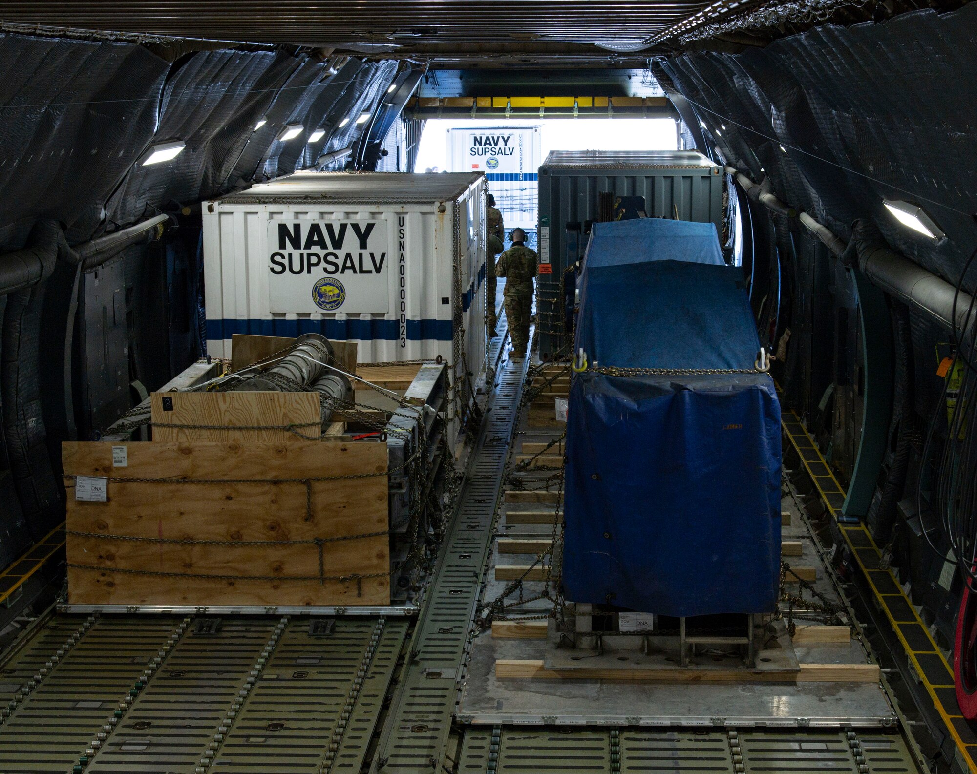 U.S. Navy Supervisor of Salvage and Diving (SUPSALV) cargo sits in the cargo compartment of a C-5M Super Galaxy at Dover Air Force Base, Delaware, Feb. 8, 2022. Loadmasters from the 9th Airlift Squadron along with 436th Aerial Port Squadron ramp services personnel, loaded the cargo for transport in support of Naval Sea Systems Command. (U.S. Air Force photo by Roland Balik)