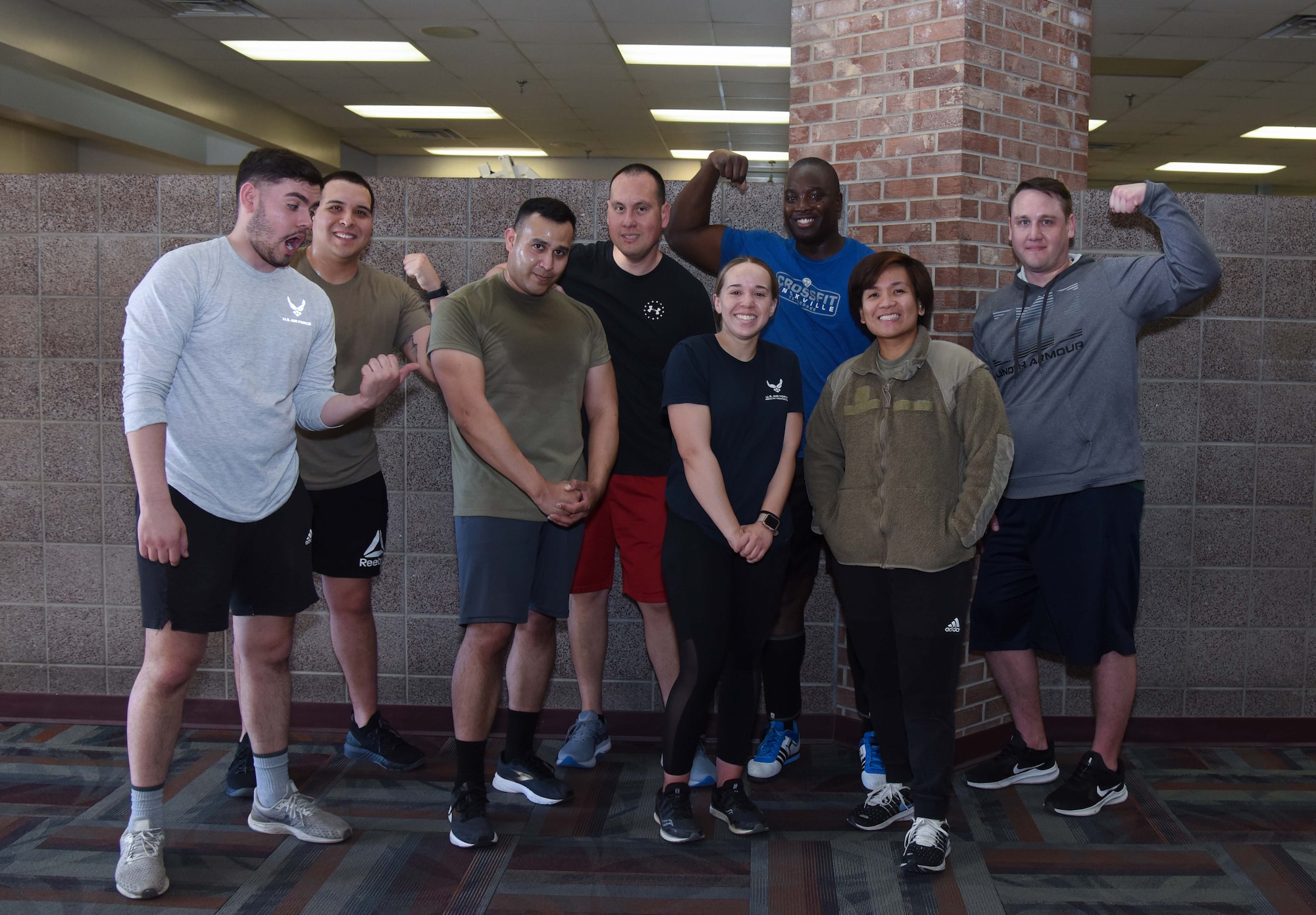 Group of people poses for a picture in gym