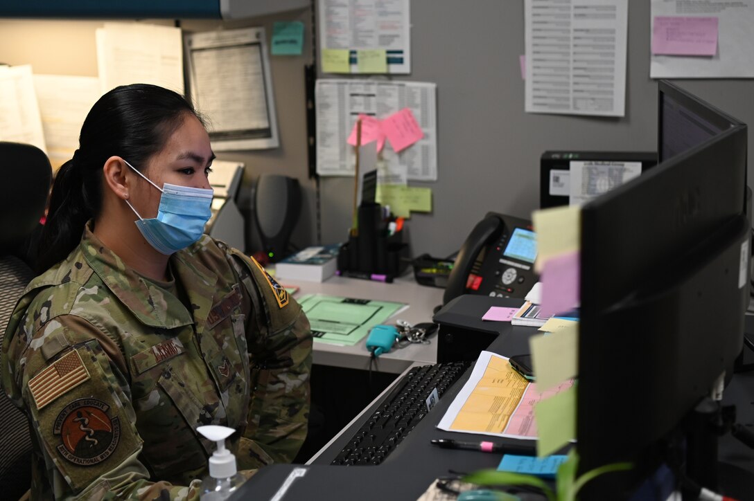 Senior Airman Joana Lanag, 30th Medical Group public health technician, works at her desk Feb. 4, 2022, on Vandenberg Space Force Base, Calif. She works diligently to protect the base, local community, and environment from the spread of disease and infection. (U.S. Space Force photo by Airman 1st Class Tiarra Sibley)