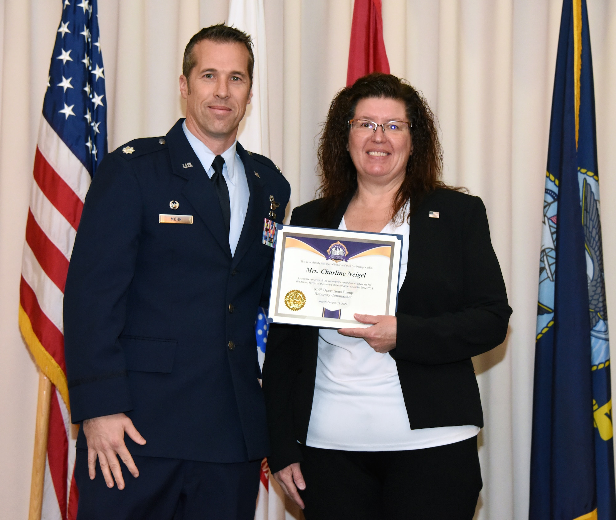 Leaders from the 514th Air Mobility Wing, join inductees, into the Honorary Commander Program at Joint Base McGuire-Dix-Lakehurst, N.J., March 11, 2022.