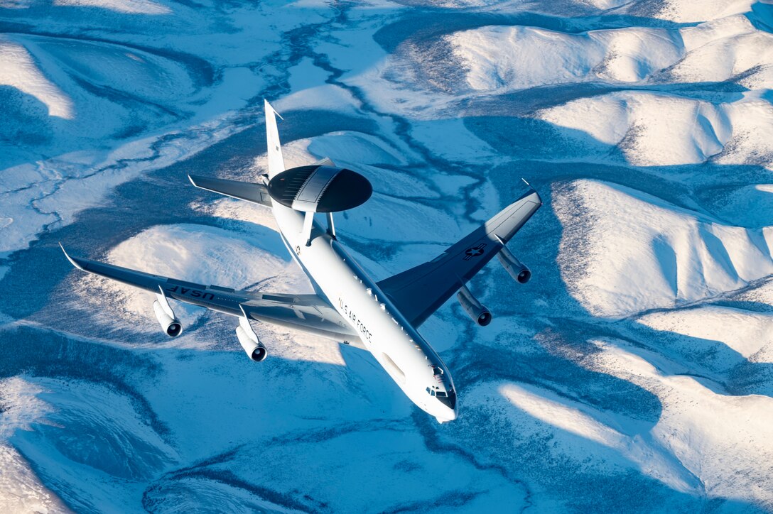 A U.S Air Force E-3 Sentry airborne warning and control system (AWACS), assigned to the 962nd Airborne Air Control Squadron, flies over Alaska during U.S. Northern Command Exercise ARCTIC EDGE 2022, March 16, 2022. AE22 is a biennial homeland defense exercise designed to provide high quality and effective joint training in austere cold weather conditions. AE22 is the largest joint exercise in Alaska, with approximately 1,000 U.S. military personnel training alongside members of the Canadian Armed Forces. (U.S. Air Force photo by Staff Sgt. Taylor Crul)