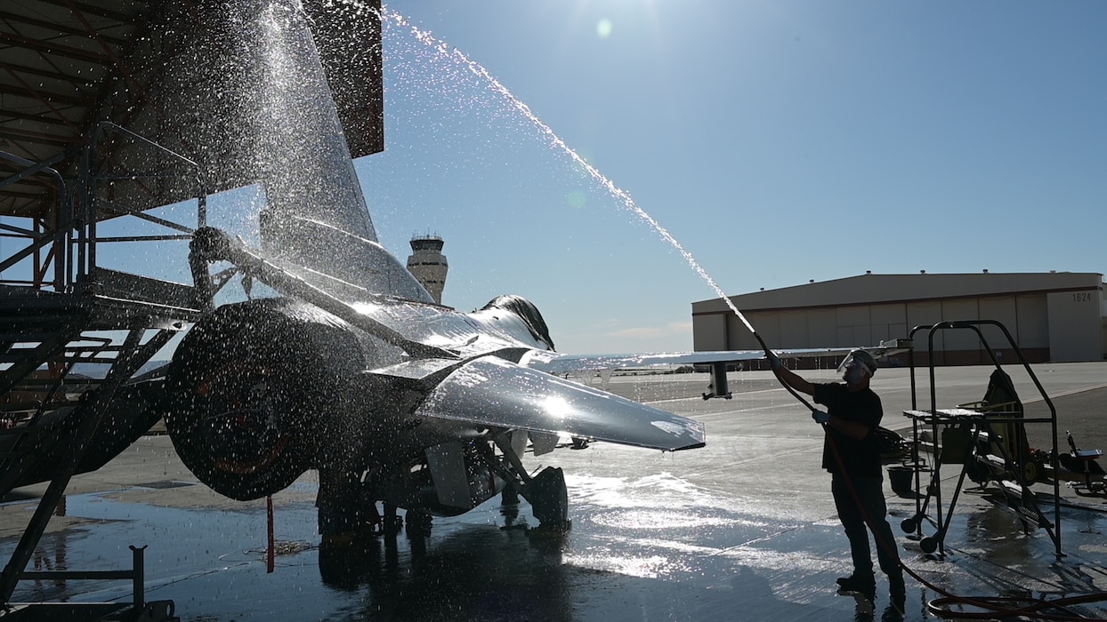 F-16 crew chiefs on Edwards Air Force Base are busy washing the aircraft to prevent corrosion.