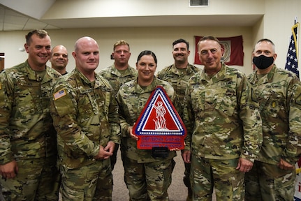 Master Sgt. Jessica Dickenson, center, poses with her team during an awards ceremony with the Virginia Army National Guard’s Recruiting and Retention Battalion June 11, 2021, at the State Military Reservation in Virginia Beach, Virginia. (U.S. Army National Guard photo by Sgt. 1st Class Terra C. Gatti)