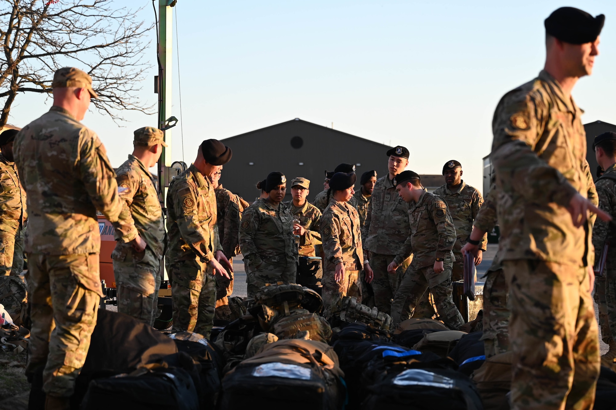 375th Security Forces Squadron Airmen, line up luggage to be palletized during a rapid deployment rehearsal on Scott Air Force Base, Illinois, March 16, 2022. This deployment mobility rehearsal emphasizes readiness of command and control procedures and continuity of operations in a simulated contested environment. (U.S. Air Force photo by Airman 1st Class Mark Sulaica)