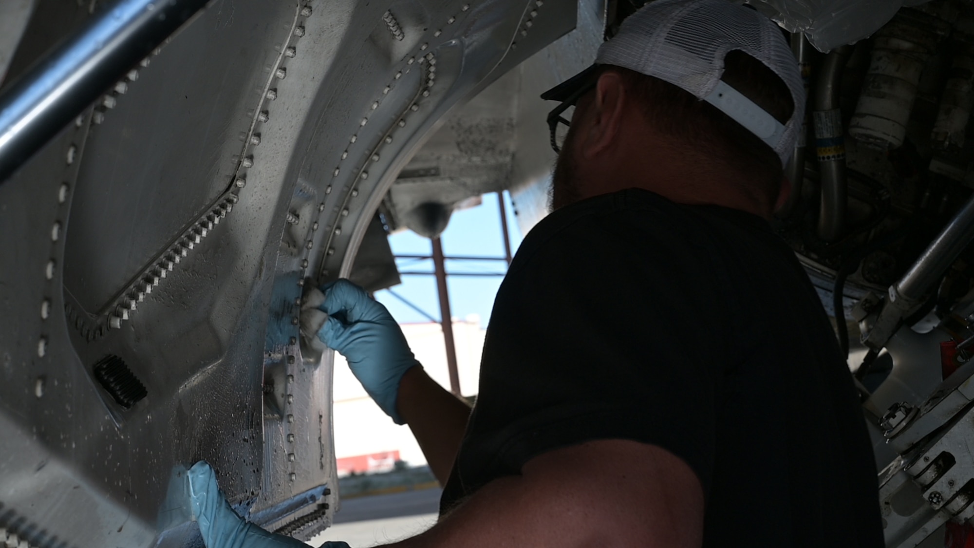 F-16 crew chiefs on Edwards Air Force Base are busy washing the aircraft to prevent corrosion.