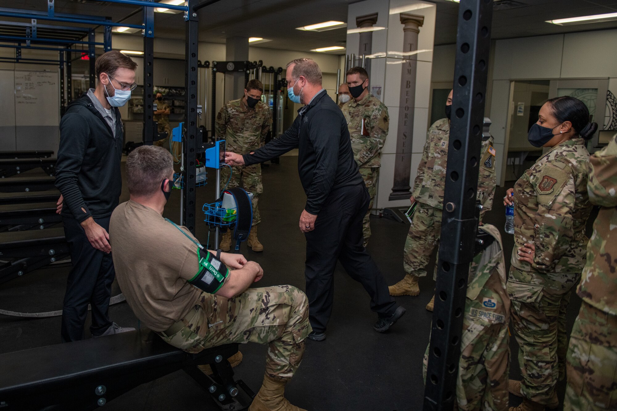 Joe Kirkman (center), Special Warfare Training Wing, physical therapist, briefs the SWTW training process and equipment during the STARCOM Senior Leadership Visit, Feb. 16, 2022, Joint Base San Antonio-Chapman Annex, Texas. The STARCOM senior leaders learned how the SWTW combines research, technology integration, strength and conditioning, performance nutrition, physical and occupational therapy, and psychology into the Air Force Special Warfare training pipeline. (U.S. Air Force photo by Thomas Coney).