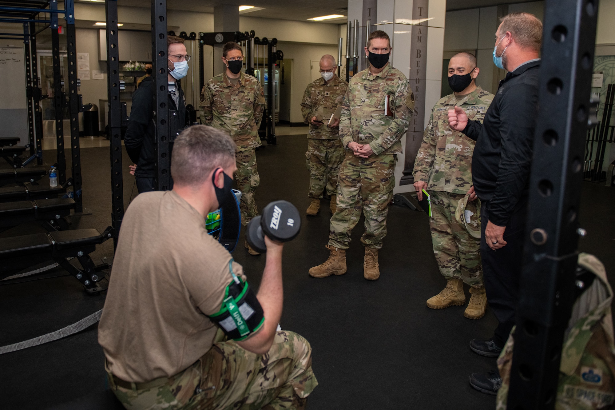 Joe Kirkman (center), Special Warfare Training Wing, physical therapist, briefs the SWTW training process and equipment during the STARCOM Senior Leadership Visit, Feb. 16, 2022, Joint Base San Antonio-Chapman Annex, Texas. The STARCOM senior leaders learned how the SWTW combines research, technology integration, strength and conditioning, performance nutrition, physical and occupational therapy, and psychology into the Air Force Special Warfare training pipeline. (U.S. Air Force photo by Thomas Coney).