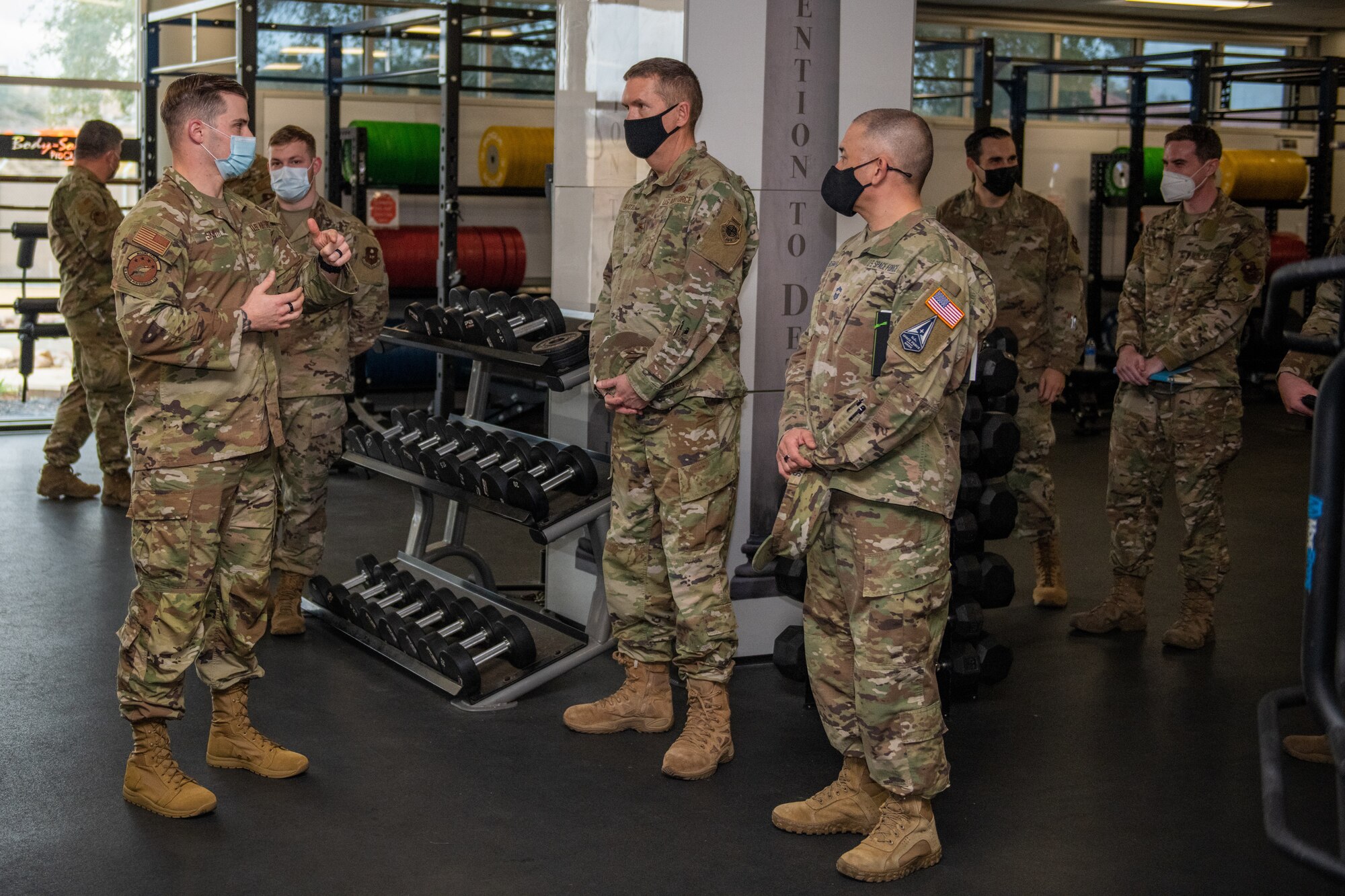 U.S. Air Force Tech. Sgt. Ryan Smith (left), Special Warfare Training Wing, physical medicine technician, briefs U.S. Space Force Brig. Gen. Shawn N. Bratton (center right), Commander, Space Training and Readiness Command and Chief Master Sgt. James P. Seballes (left), Space Training and Readiness Command, senior enlisted leader, during their visit to the SWTW, Feb. 16, 2022, Joint Base San Antonio-Chapman Annex, Texas. The STARCOM senior leaders learned how the SWTW combines research, technology integration, strength and conditioning, performance nutrition, physical and occupational therapy, and psychology into the Air Force Special Warfare training pipeline. (U.S. Air Force photo by Thomas Coney).