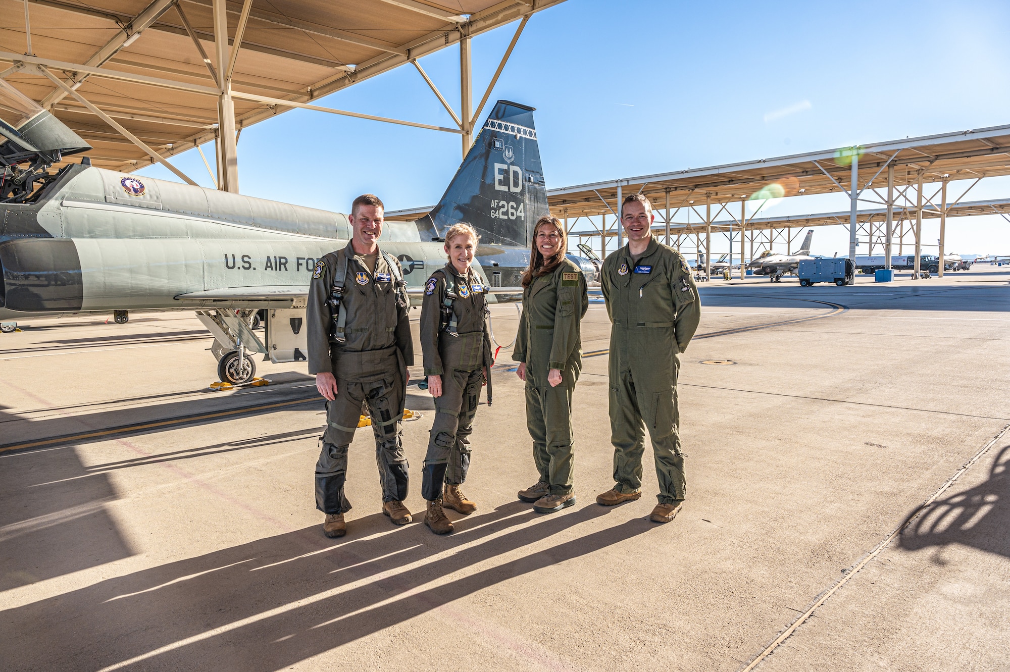 Group photo of Lt. Col. Joshua Egan, 412th Test Wing Chief of Safety, Maj. Gen. Jeannie Leavitt, Department of  the Air Force Chief of Safety, Laura Macaluso, Director, Department of Defense Force Safety and Occupational Health, and Maj. Philip Downing, 370th Flight Test Squadron, F-16 Test Pilot