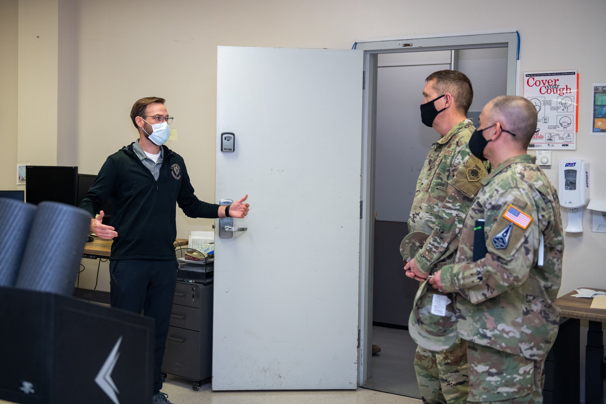 Chase Feldbrugge (left), Special Warfare Training Wing, athletic trainer, briefs U.S. Space Force Brig. Gen. Shawn N. Bratton (center right), Commander, Space Training and Readiness Command and Chief Master Sgt. James P. Seballes (left), Space Training and Readiness Command, senior enlisted leader, during their visit to the SWTW, Feb. 16, 2022, Joint Base San Antonio-Chapman Annex, Texas. The STARCOM senior leaders learned how the SWTW combines research, technology integration, strength and conditioning, performance nutrition, physical and occupational therapy, and psychology into the Air Force Special Warfare training pipeline. (U.S. Air Force photo by Thomas Coney).