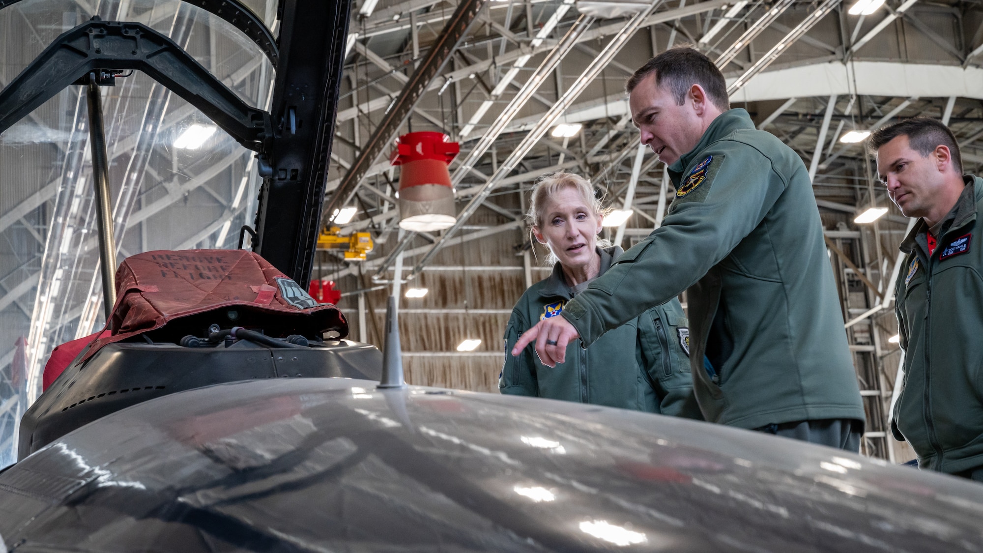 Maj. Jacob Schonig, 416th Flight Test Squadron, F-16 Test Pilot, briefs Maj. Gen. Jeannie Leavitt, Department of the Air Force Chief of Safety, on the X-62A Variable In-flight Simulator Aircraft