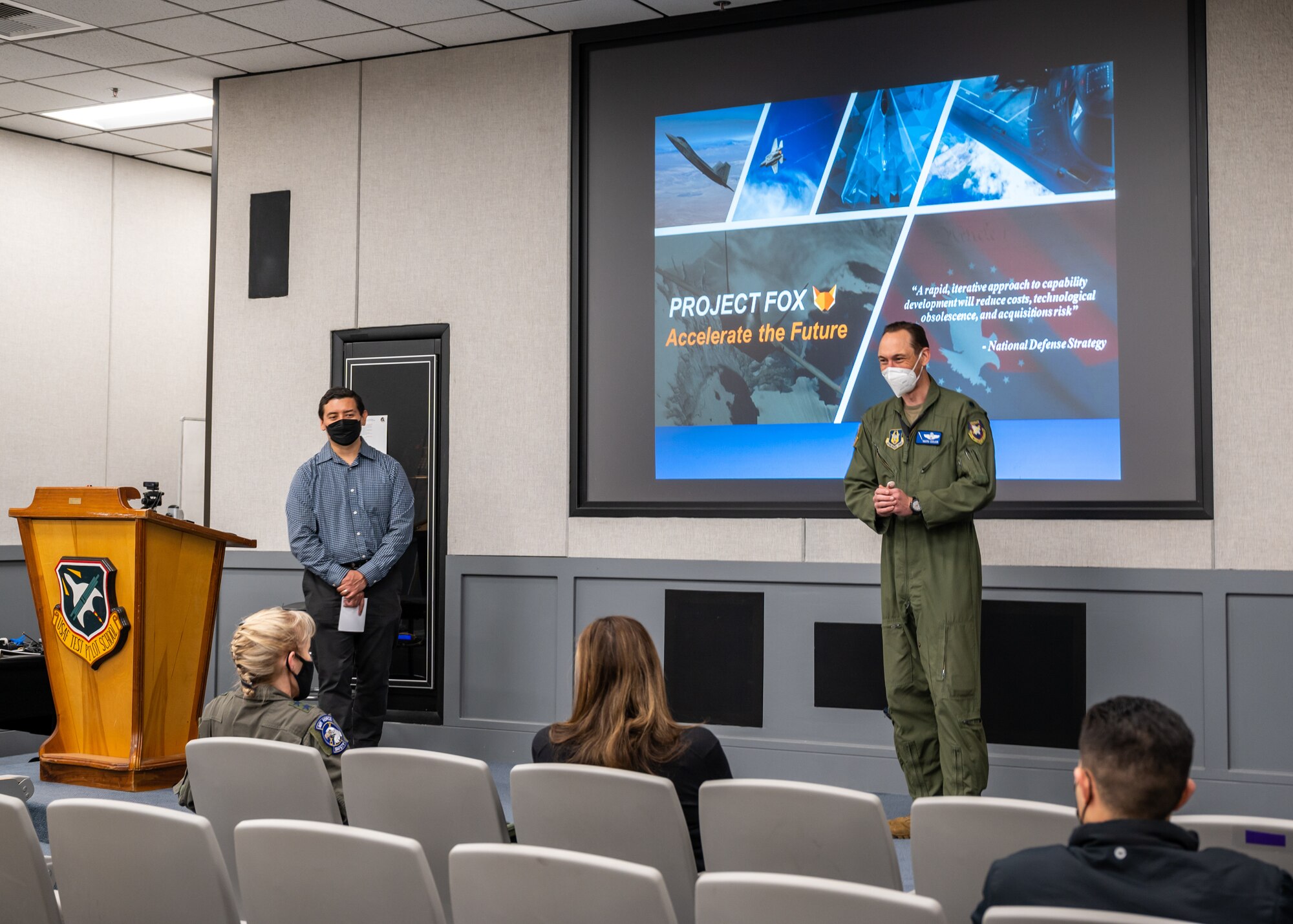 t. Col. Raven LeClair, 370th Flight Test Squadron, briefs Laura Macaluso, Director, Department of Defense Force Safety and Occupational Health, and Maj. Gen. Jeannie Leavitt, Air Force Chief of Safety, on the Fighter Optimization eXperiment, or FoX