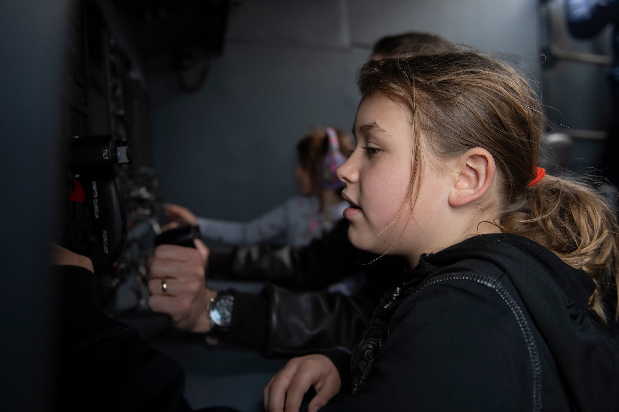 A child attending the Youth Open House at Moody Air Force Base, Georgia, interacts with the primary flight display on an HC-130J Combat King II, March 12, 2022. The Youth Open House culminated Women In Aviation Week and was aimed to connect a younger generation to Airmen and inspire them for careers in airpower leading to a more diverse and effective Air Force in the future. (U.S. Air Force Airman 1st Class Rachel Perkinson)