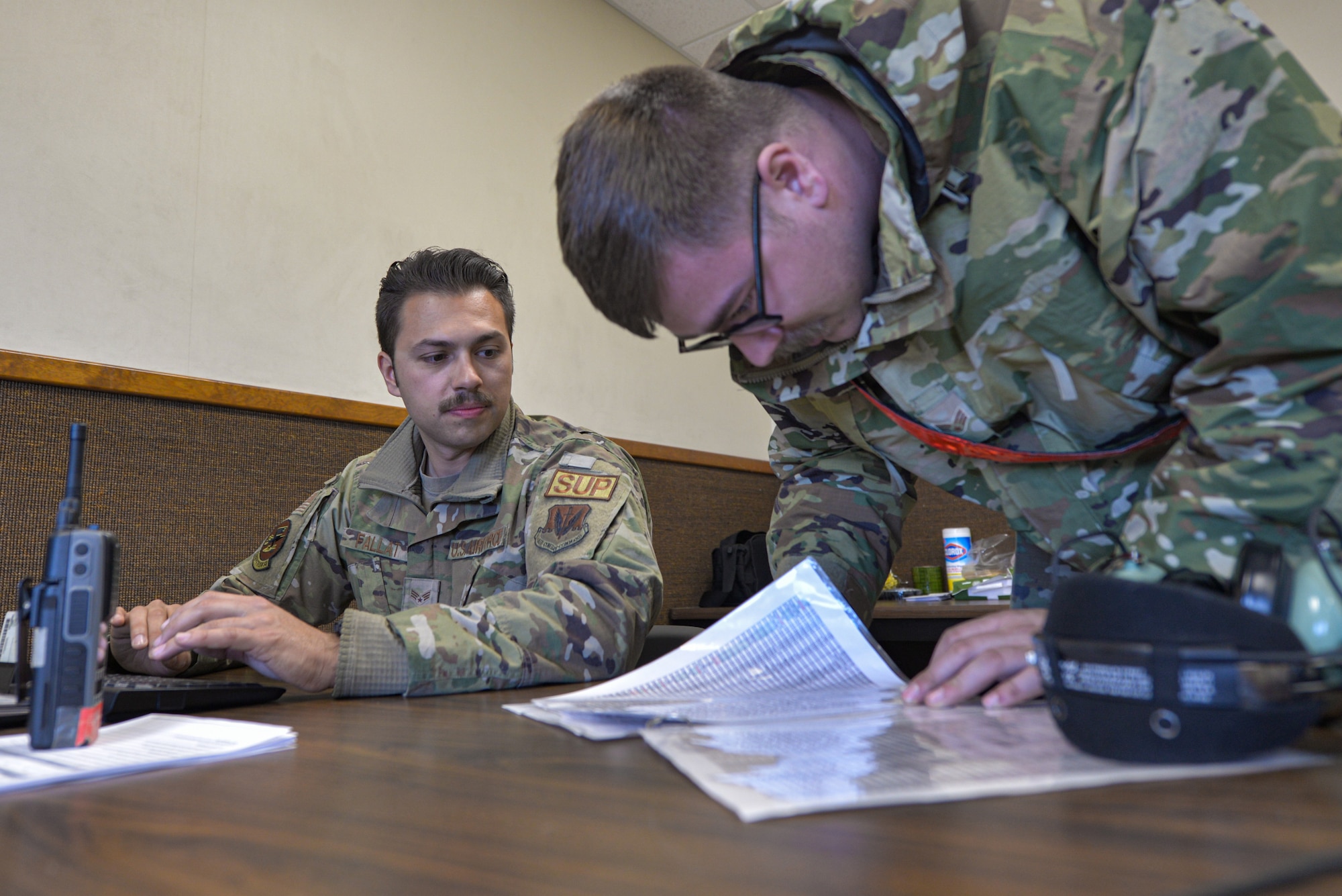 Airmen work together to locate parts.