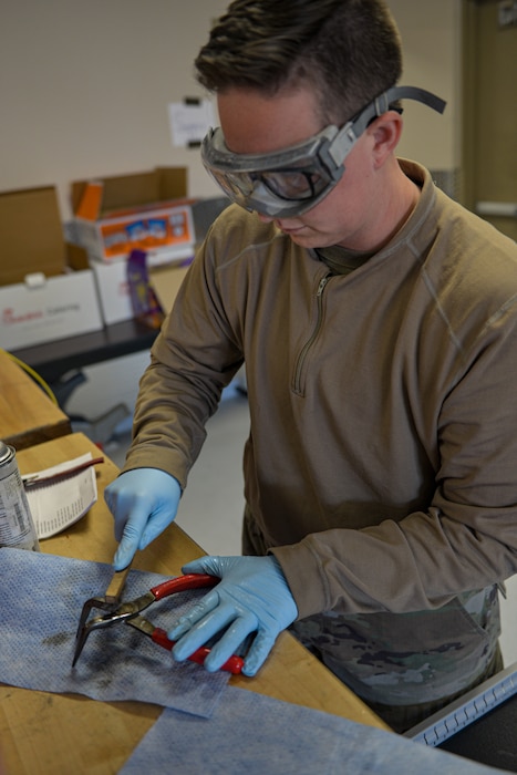 U.S. Air Force Senior Airman Ely Shilaikis, 389th Fighter Generation Squadron consolidated tool kit primary custodian, performs a “180 day” inspection during Red Flag-Nellis 22-2 on Nellis Air Force Base, Nevada, March 10, 2022. The 180 day inspection is a thorough cleaning and examination to ensure serviceability of the tools assigned to a consolidated tool kit. (U.S. Air Force photo by Staff Sgt. Austin Siegel)