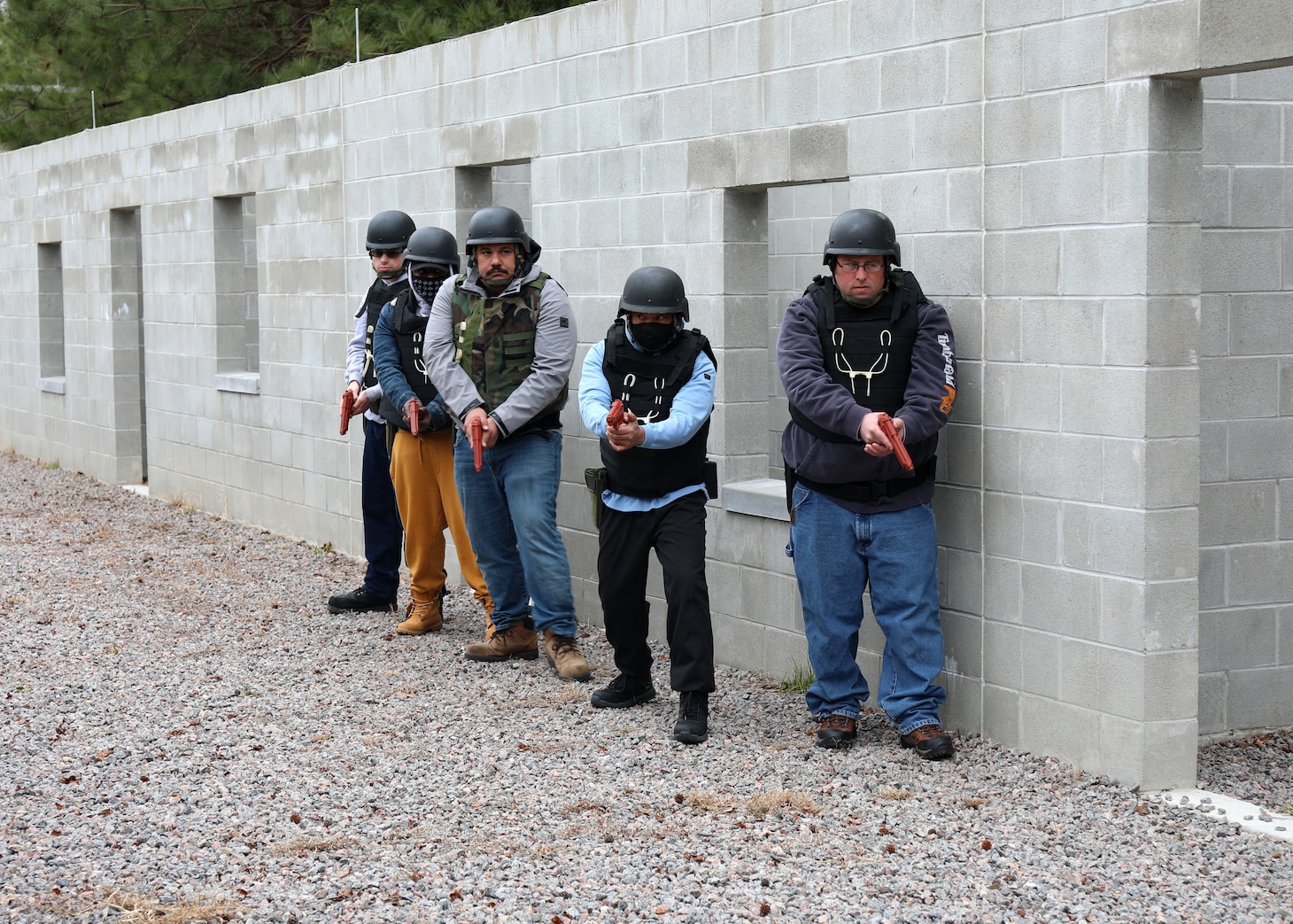 Civil Service Mariners practice clearing spaces of simulated security threats at the Military Sealift Command Training Center East on Joint Base Langley-Fort Eustis, Virginia, Feb. 24.