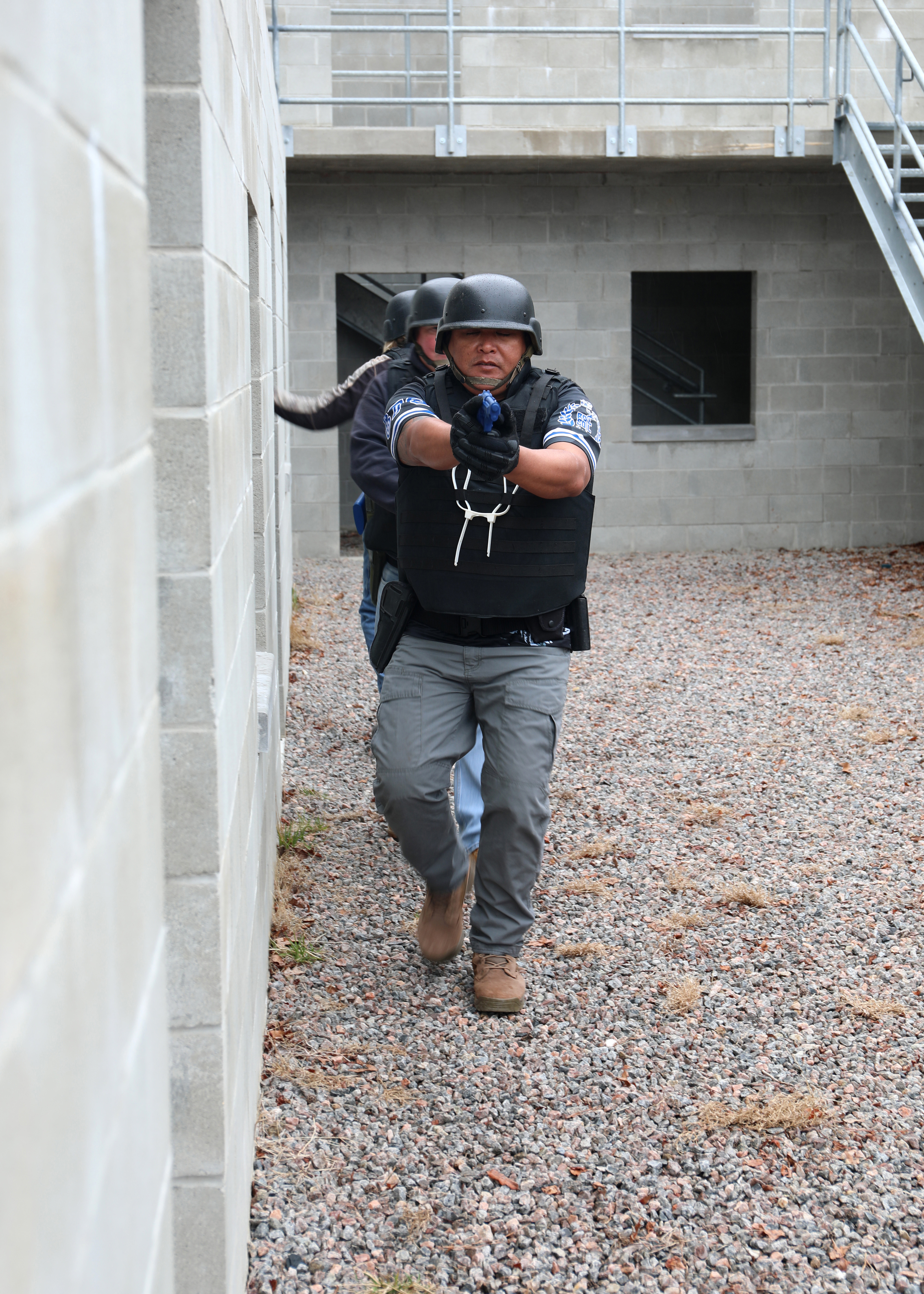 Civil Service Mariners practice clearing spaces of simulated security threats at the Military Sealift Command Training Center East on Joint Base Langley-Fort Eustis, Virginia, Feb. 24.