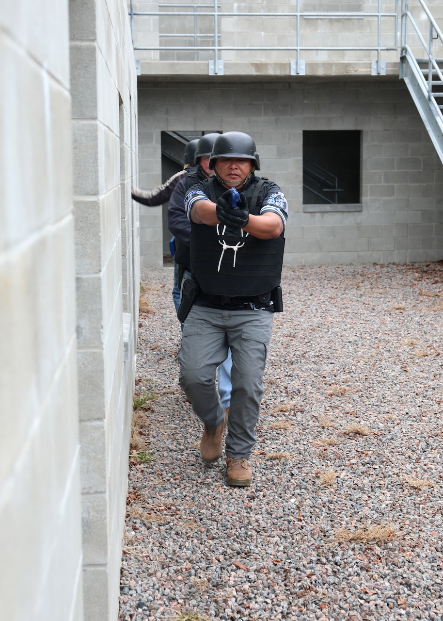 Civil Service Mariners practice clearing spaces of simulated security threats at the Military Sealift Command Training Center East on Joint Base Langley-Fort Eustis, Virginia, Feb. 24.