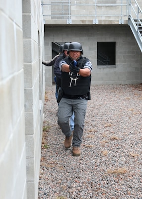 Civil Service Mariners practice clearing spaces of simulated security threats at the Military Sealift Command Training Center East on Joint Base Langley-Fort Eustis, Virginia, Feb. 24.